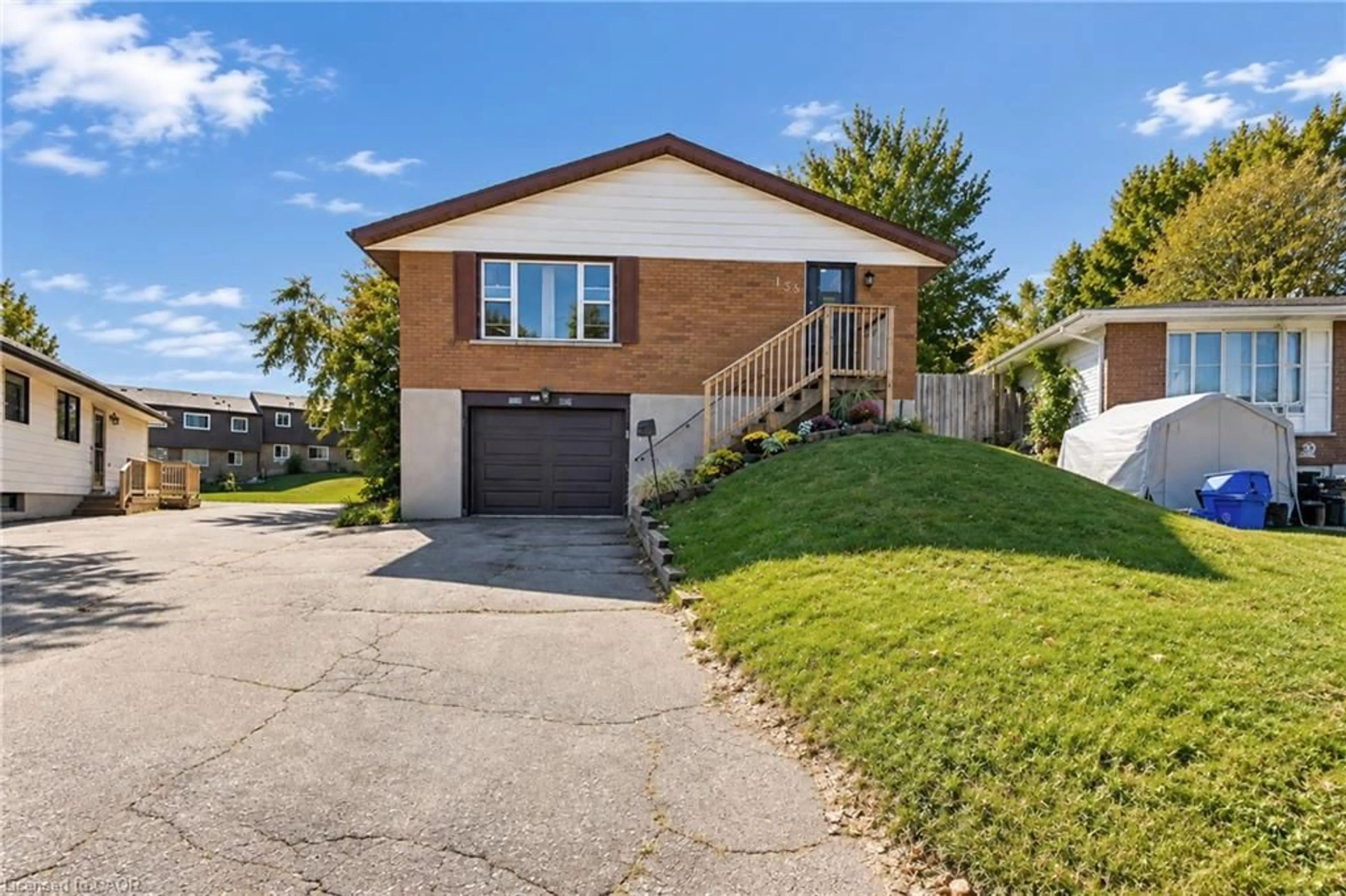 Home with brick exterior material, street for 135 Cedarhill Cres, Kitchener Ontario N2E 1R3
