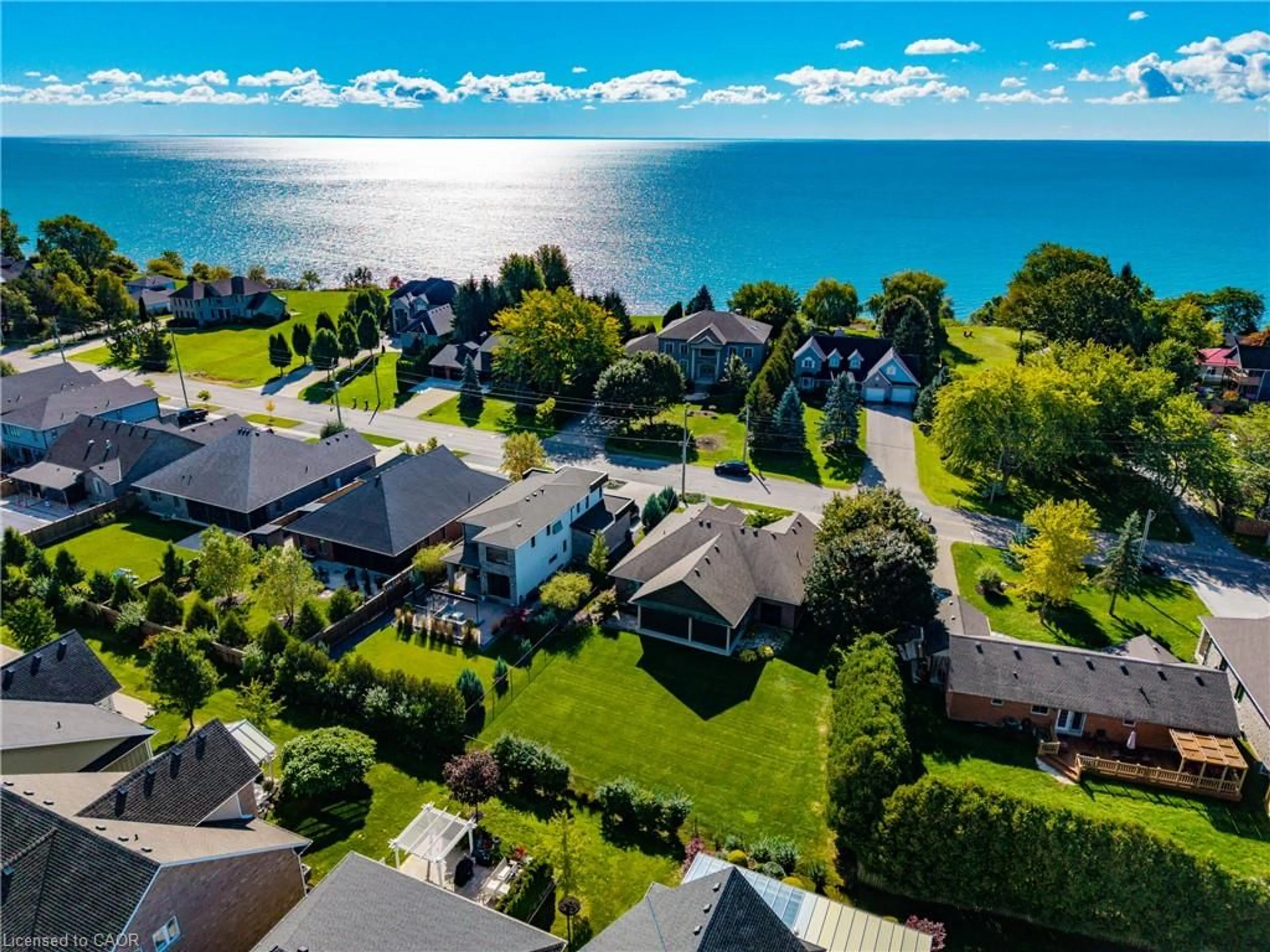 A pic from outside/outdoor area/front of a property/back of a property/a pic from drone, water/lake/river/ocean view for 135 New Lakeshore Rd, Port Dover Ontario N0A 1N3