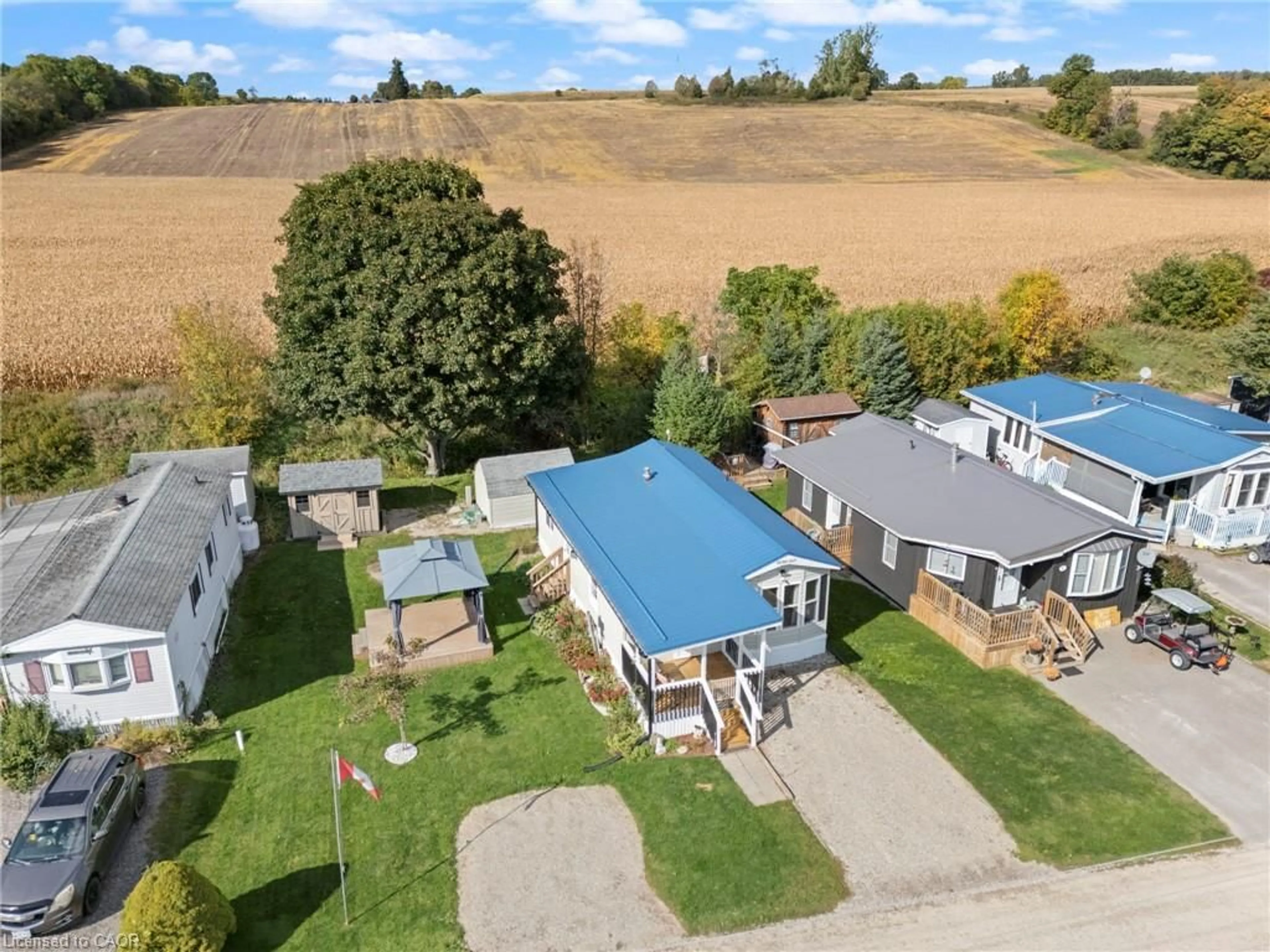 A pic from outside/outdoor area/front of a property/back of a property/a pic from drone, street for 495856 10th Line #60, Woodstock Ontario N5Y 7V7