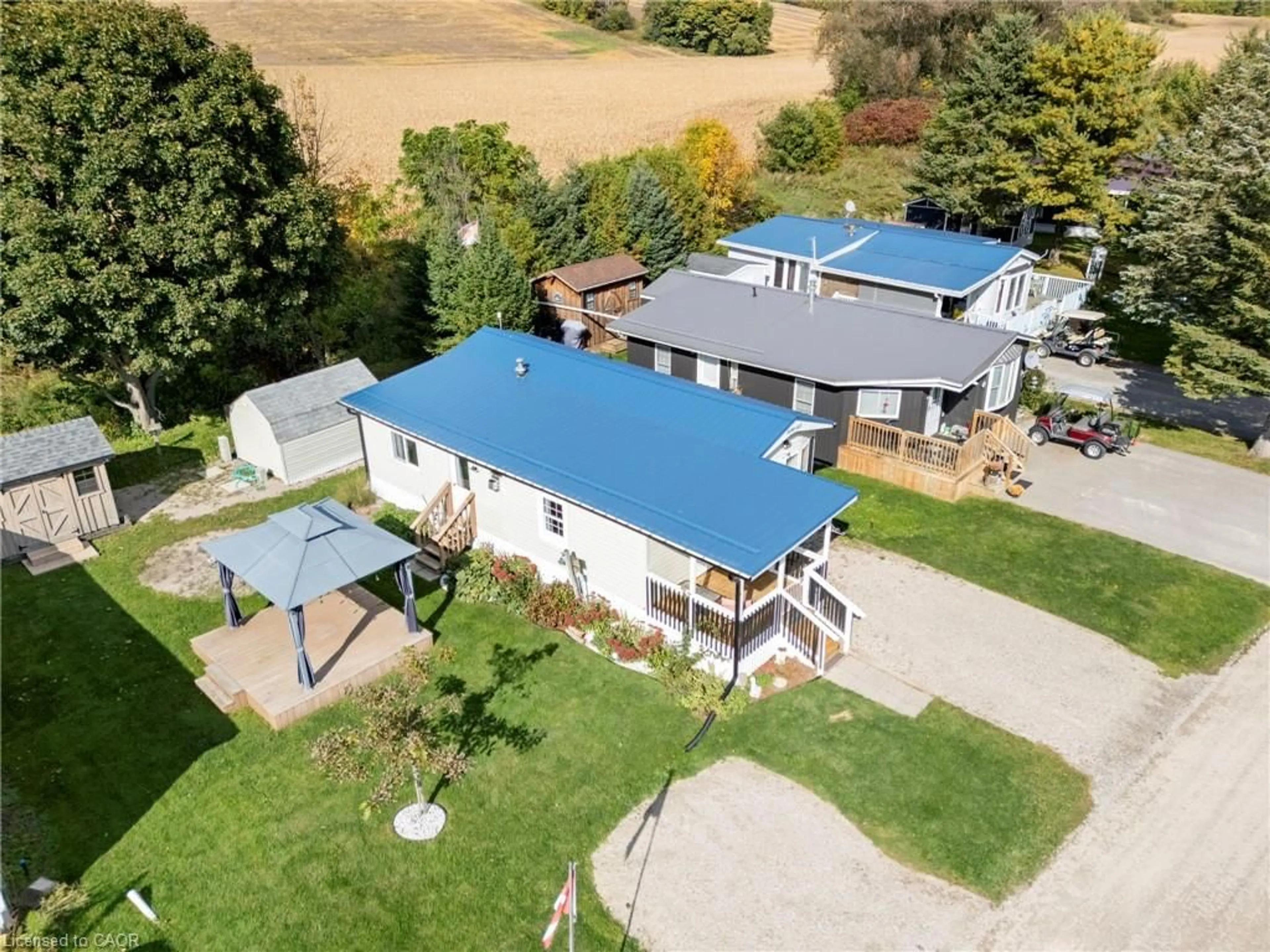 A pic from outside/outdoor area/front of a property/back of a property/a pic from drone, unknown for 495856 10th Line #60, Woodstock Ontario N5Y 7V7