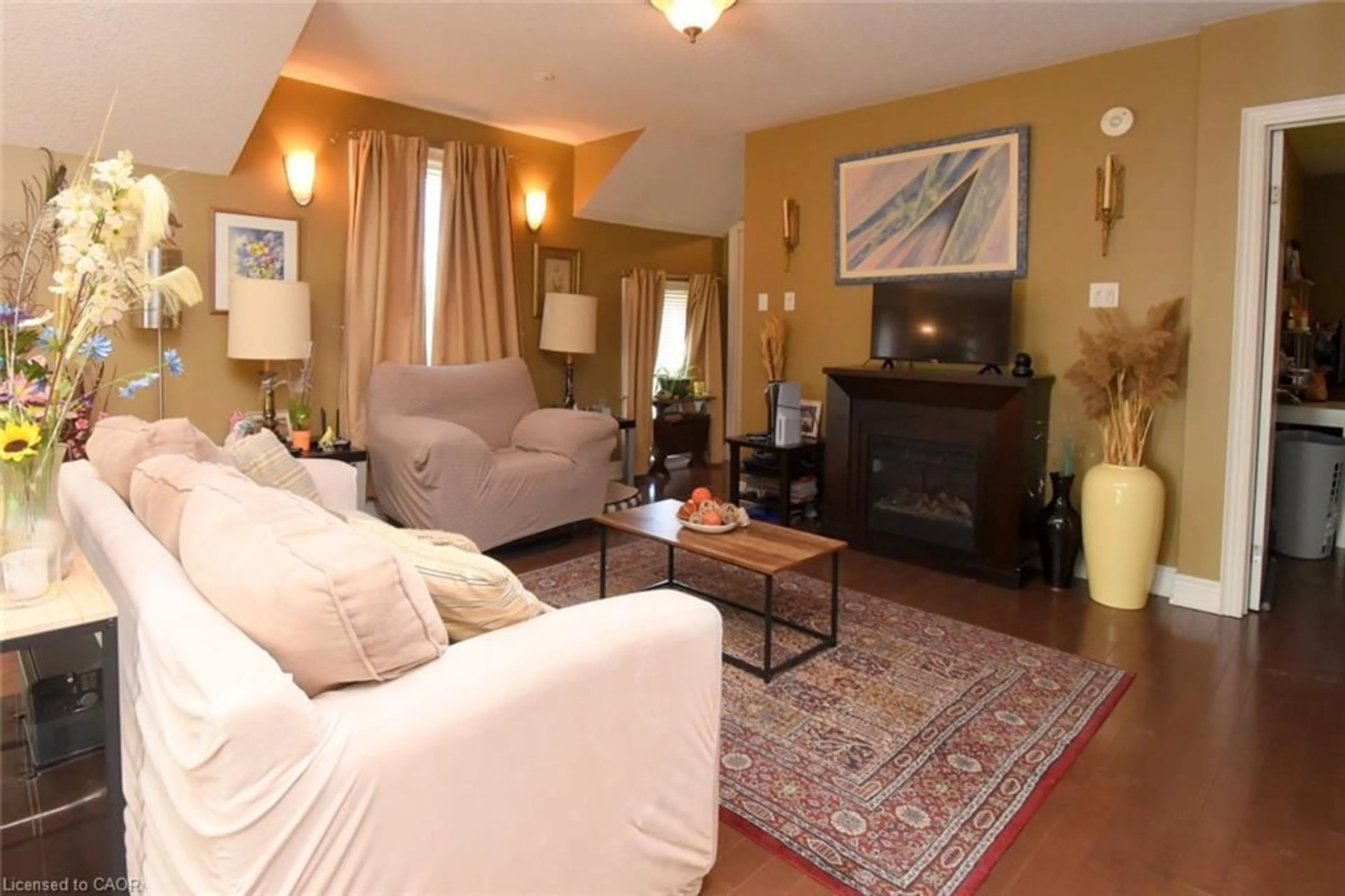 Living room with furniture, wood/laminate floor for 54 Old Mill Rd, Port Rowan Ontario N0E 1C0