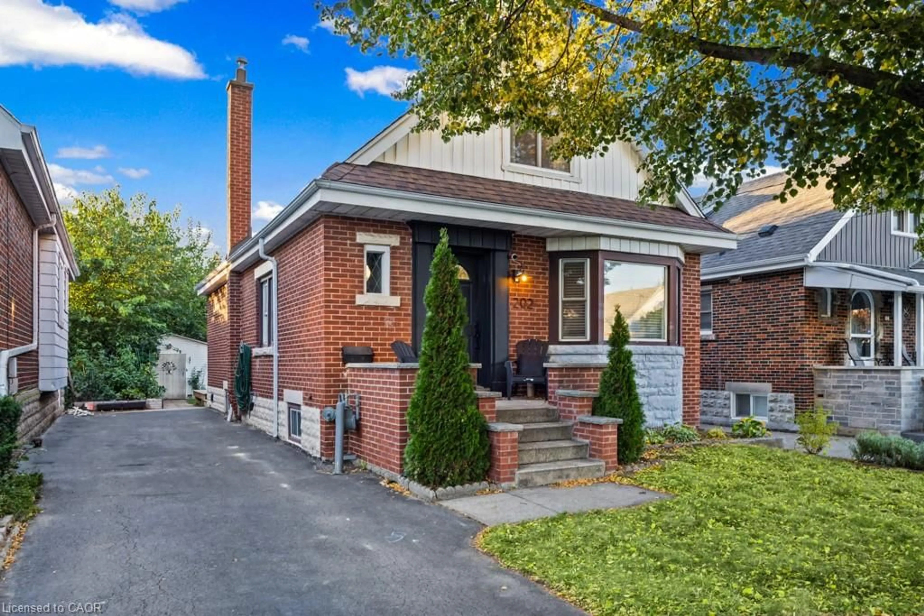 Home with brick exterior material, street for 202 Huxley Ave, Hamilton Ontario L8K 2R3