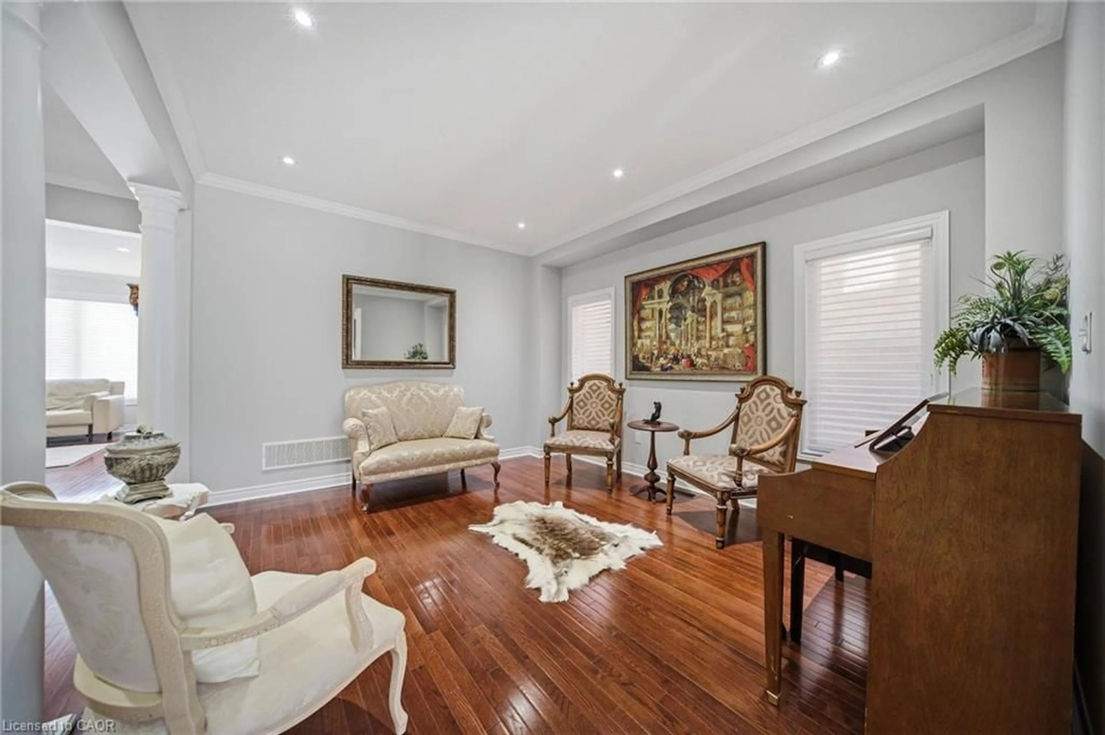 Living room with furniture, wood/laminate floor for 884 Stoutt Cres, Milton Ontario L9T 7R1