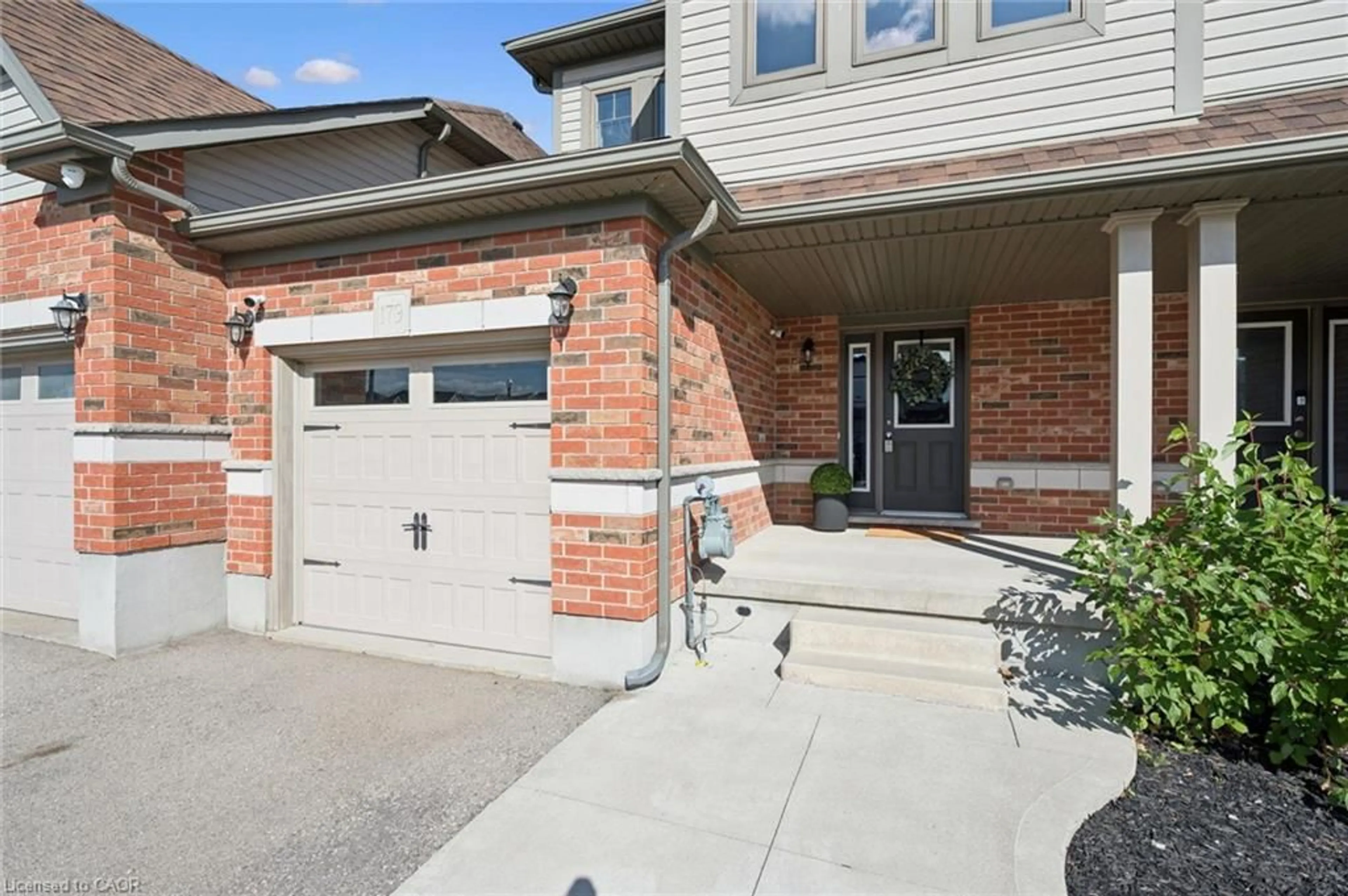Home with brick exterior material, street for 179 Eden Oak Trail, Kitchener Ontario N2A 0H6