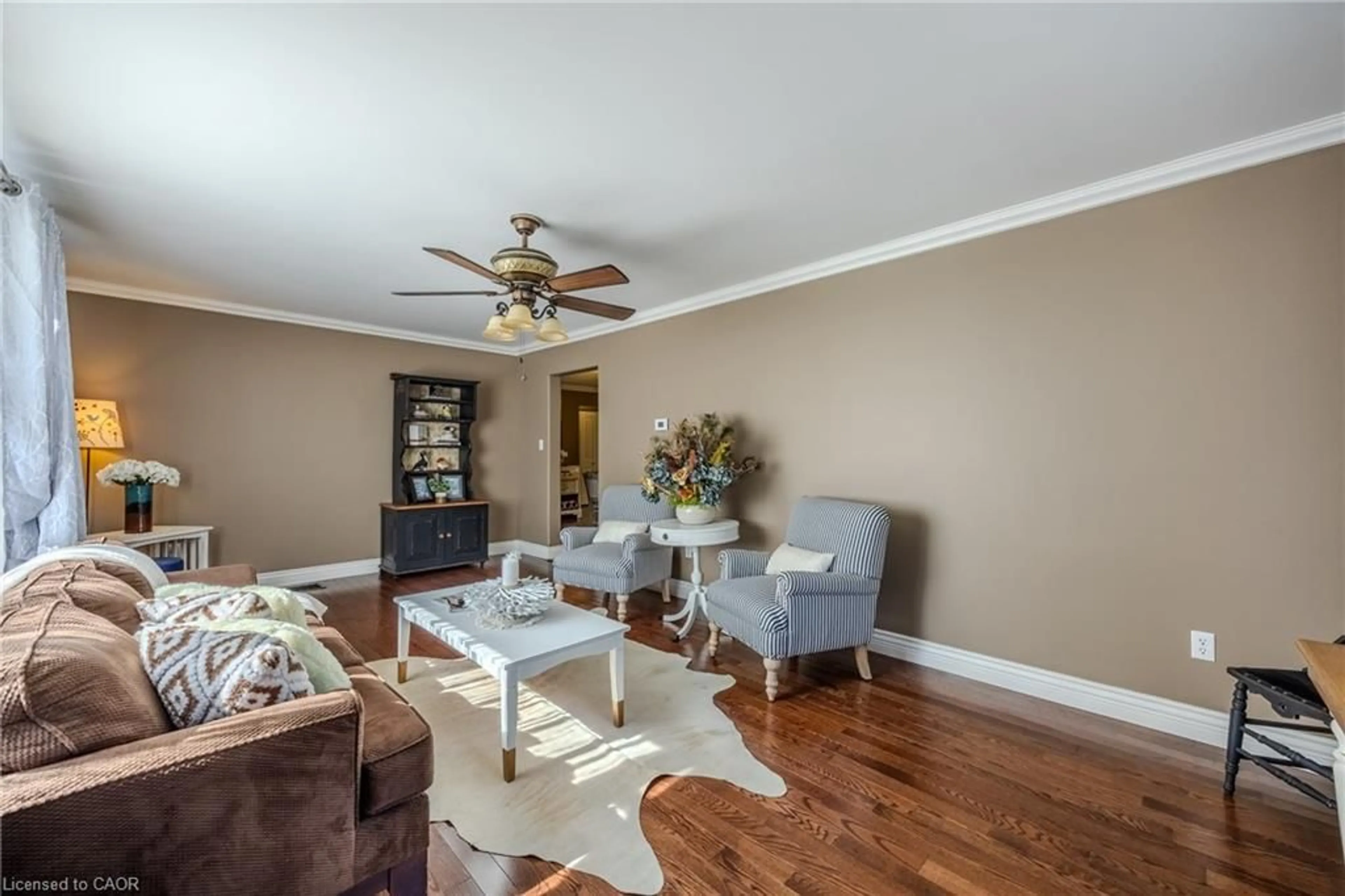 Living room with furniture, wood/laminate floor for 9 College Ave, Port Rowan Ontario N0E 1M0