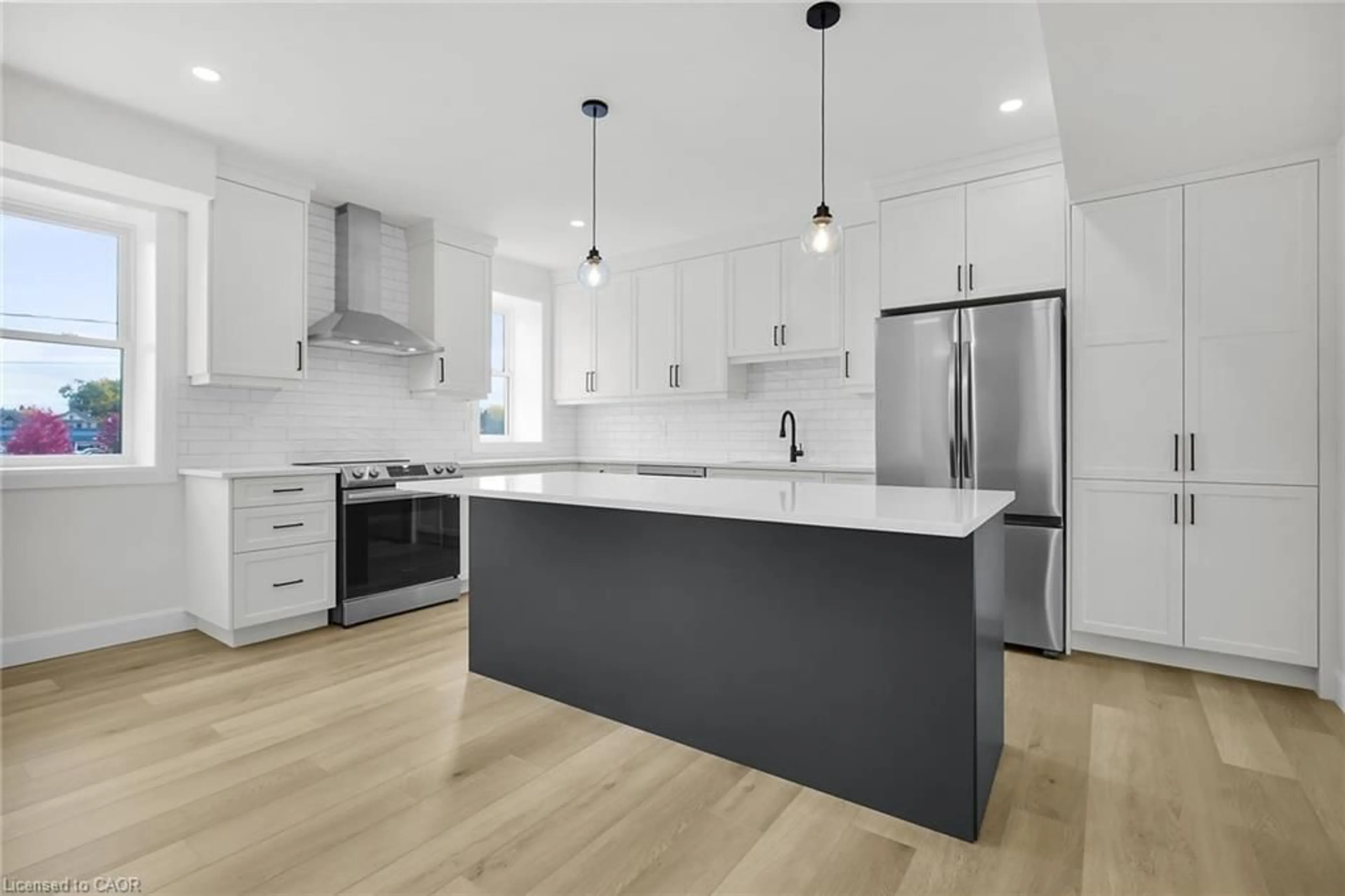 Open concept kitchen, wood/laminate floor for 74A Church St #3, Stratford Ontario N5A 1B3