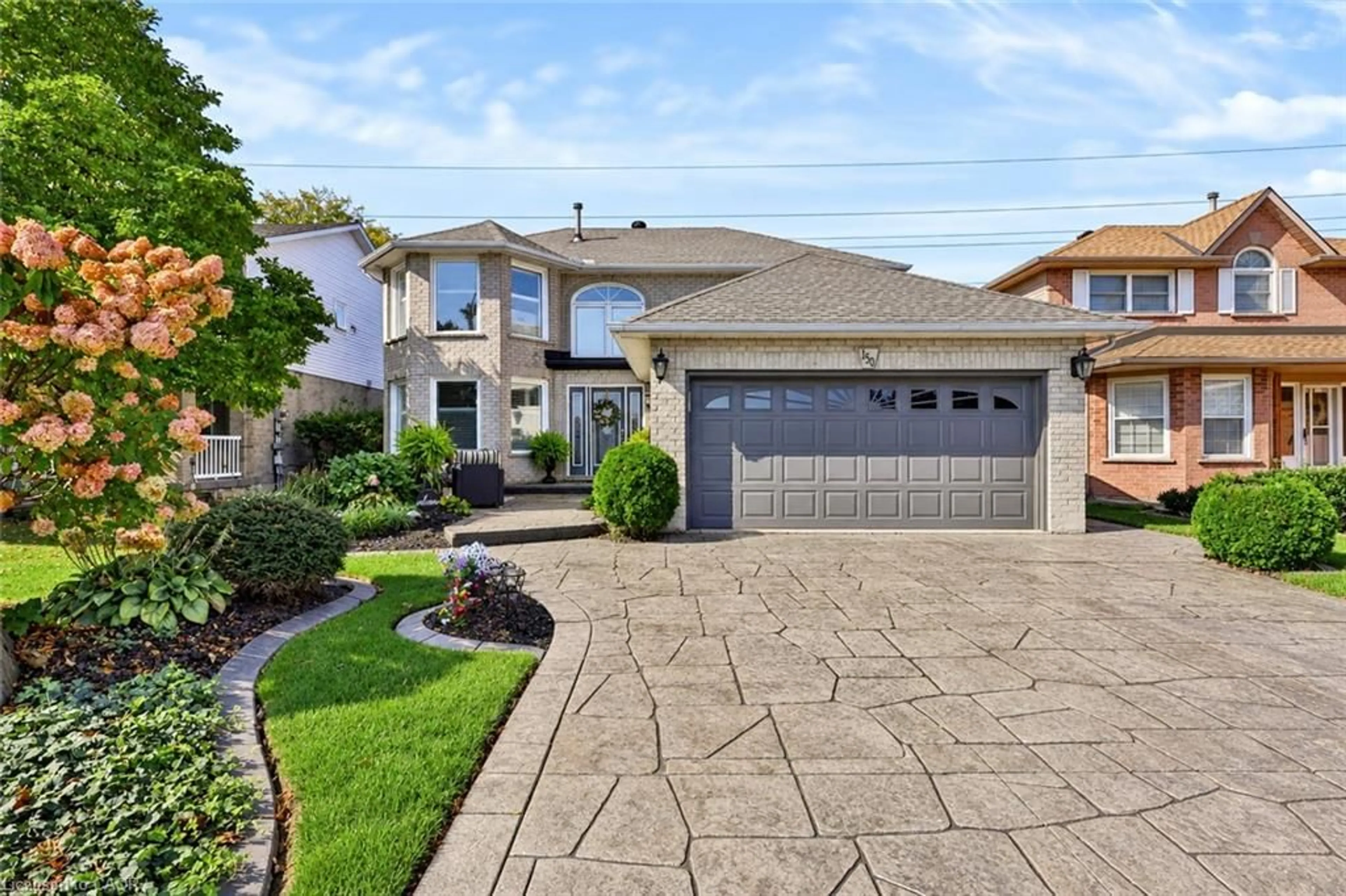 Home with brick exterior material, street for 150 Rowntree Dr, Hamilton Ontario L8W 2N6