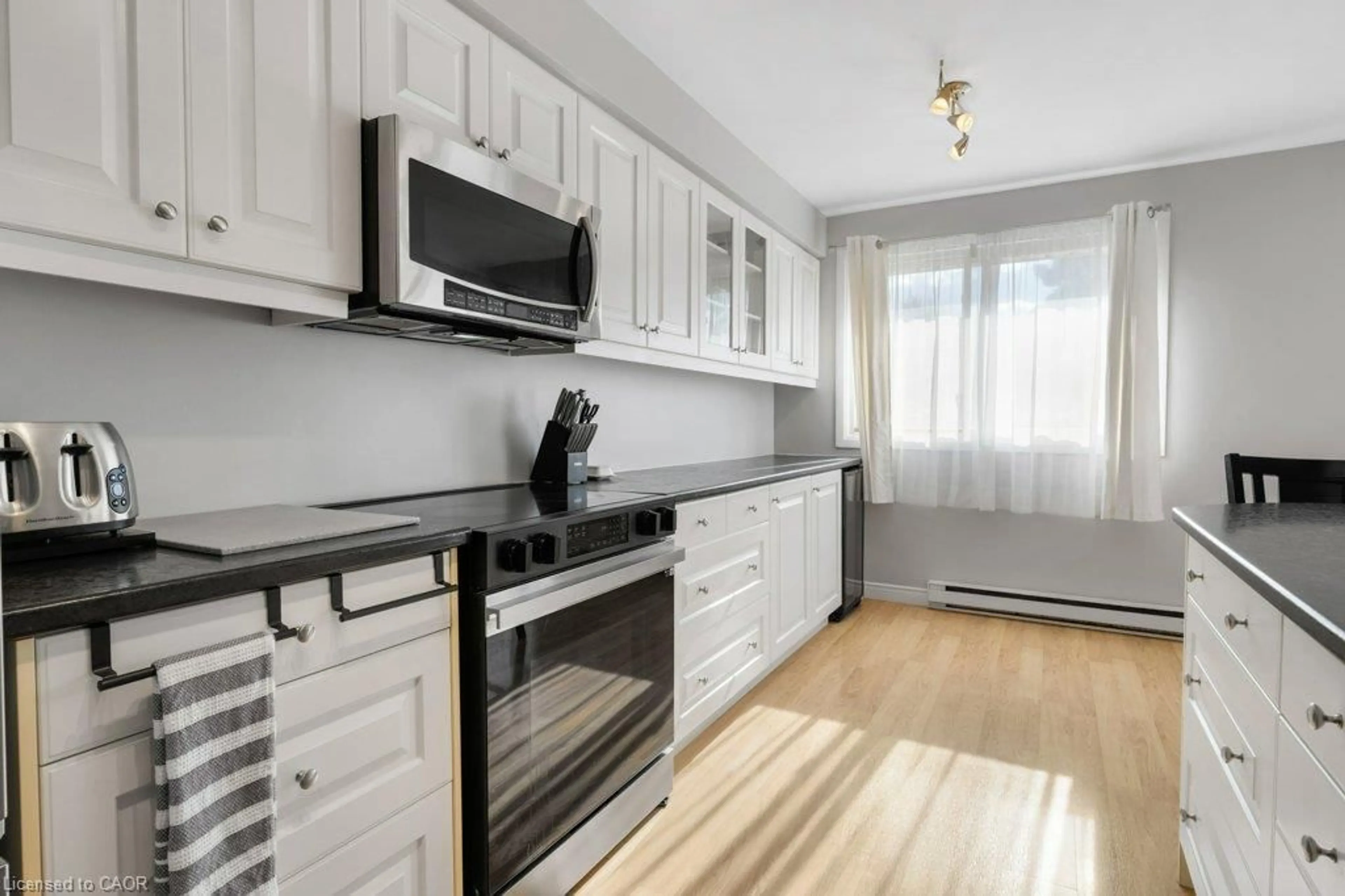 Standard kitchen, wood/laminate floor for 320 Traynor Ave #1, Kitchener Ontario N2C 2J1