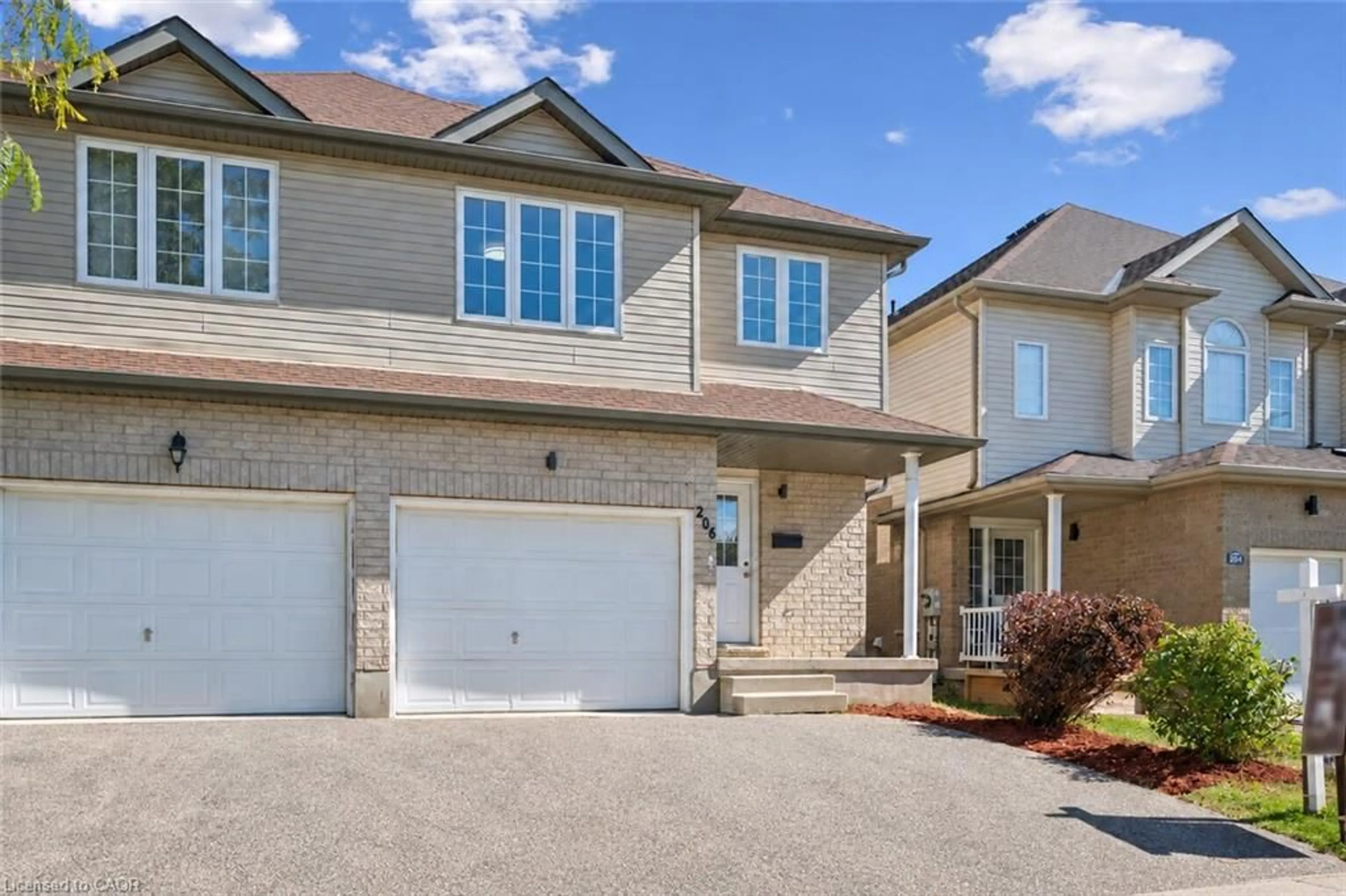 Home with brick exterior material, street for 206 Buttercup Crt, Waterloo Ontario N2V 2W8