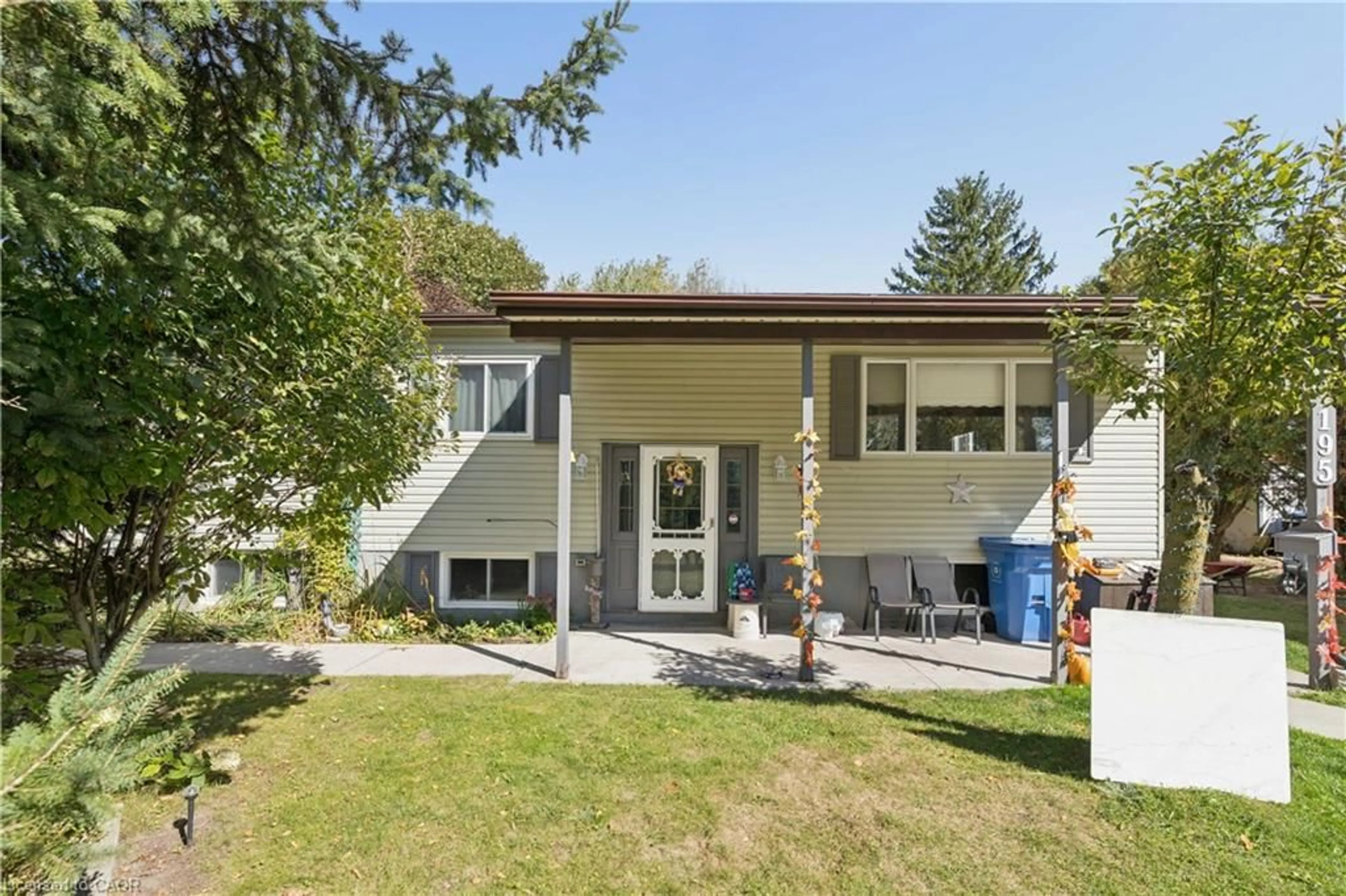 Home with vinyl exterior material, street for 195 John St, Harriston Ontario N0G 1Z0