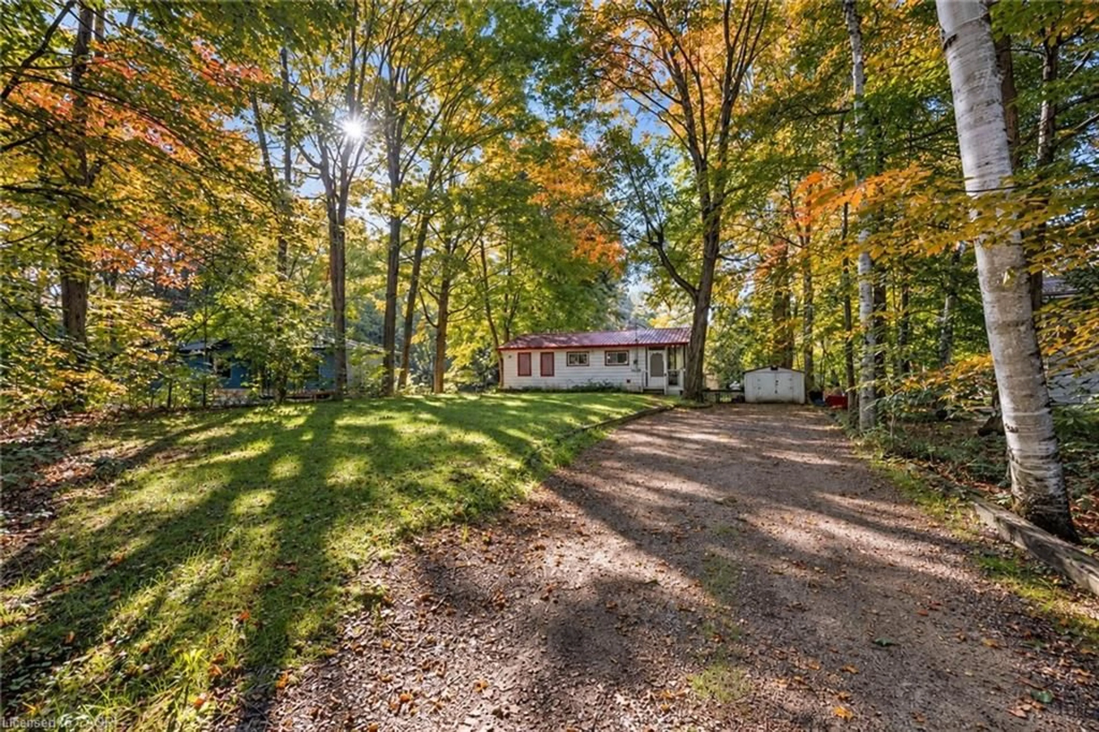 A pic from outside/outdoor area/front of a property/back of a property/a pic from drone, forest/trees view for 7465 East River Rd, Washago Ontario L0K 2B0