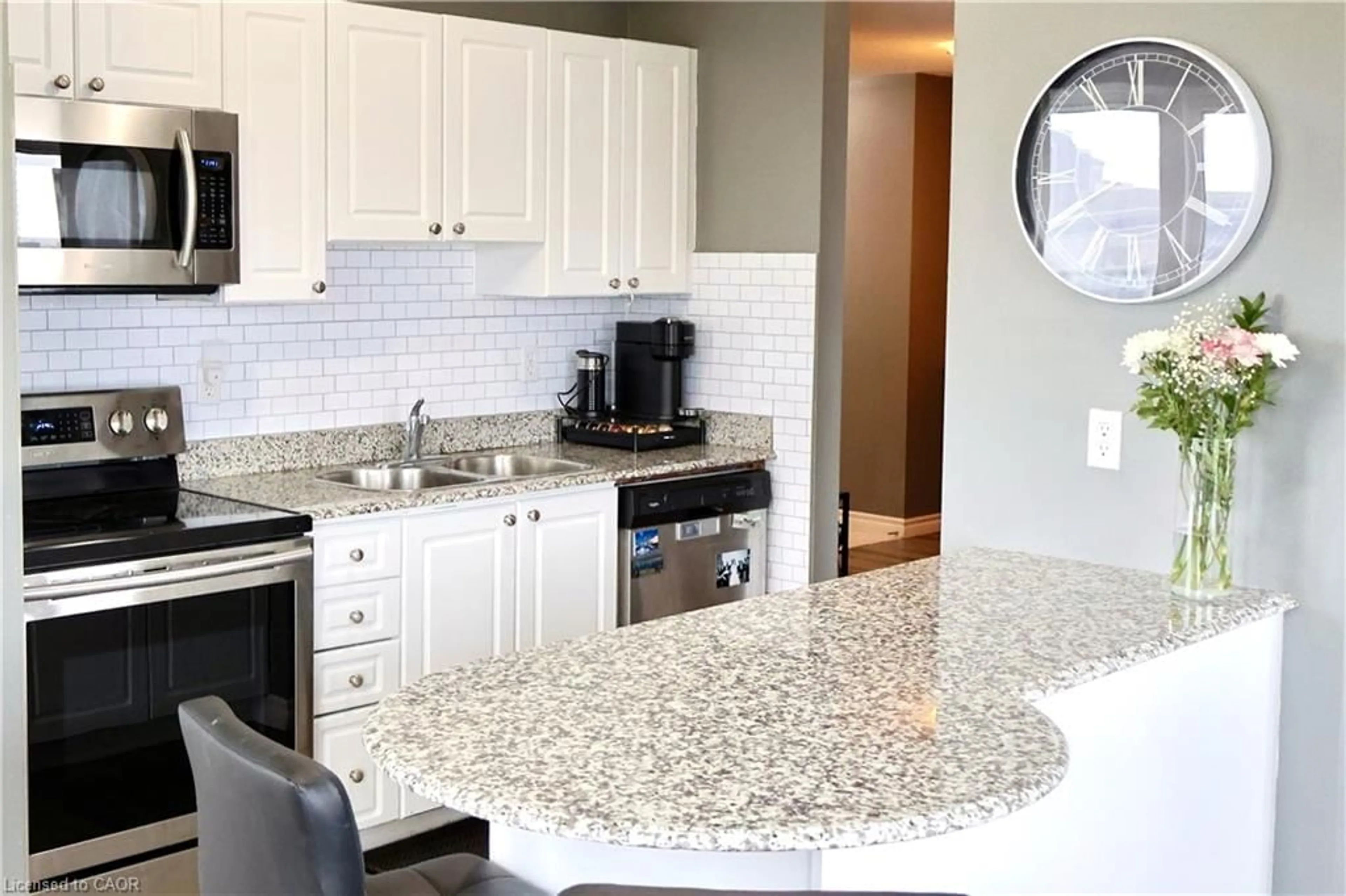 Open concept kitchen, ceramic/tile floor for 135 James St #701, Hamilton Ontario L8P 2Z6