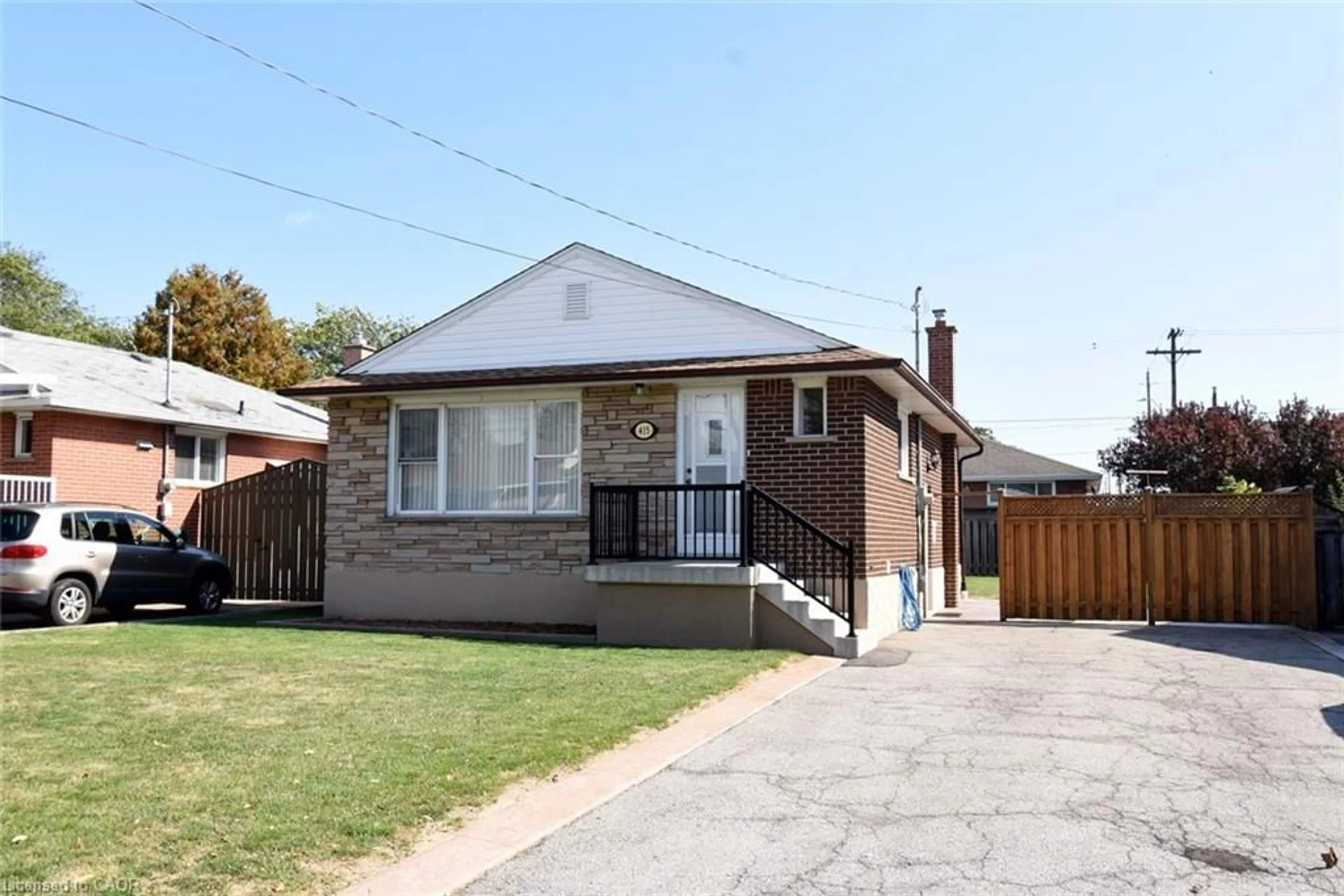 Home with brick exterior material, street for 415 East 15th St, Hamilton Ontario L9A 4G9