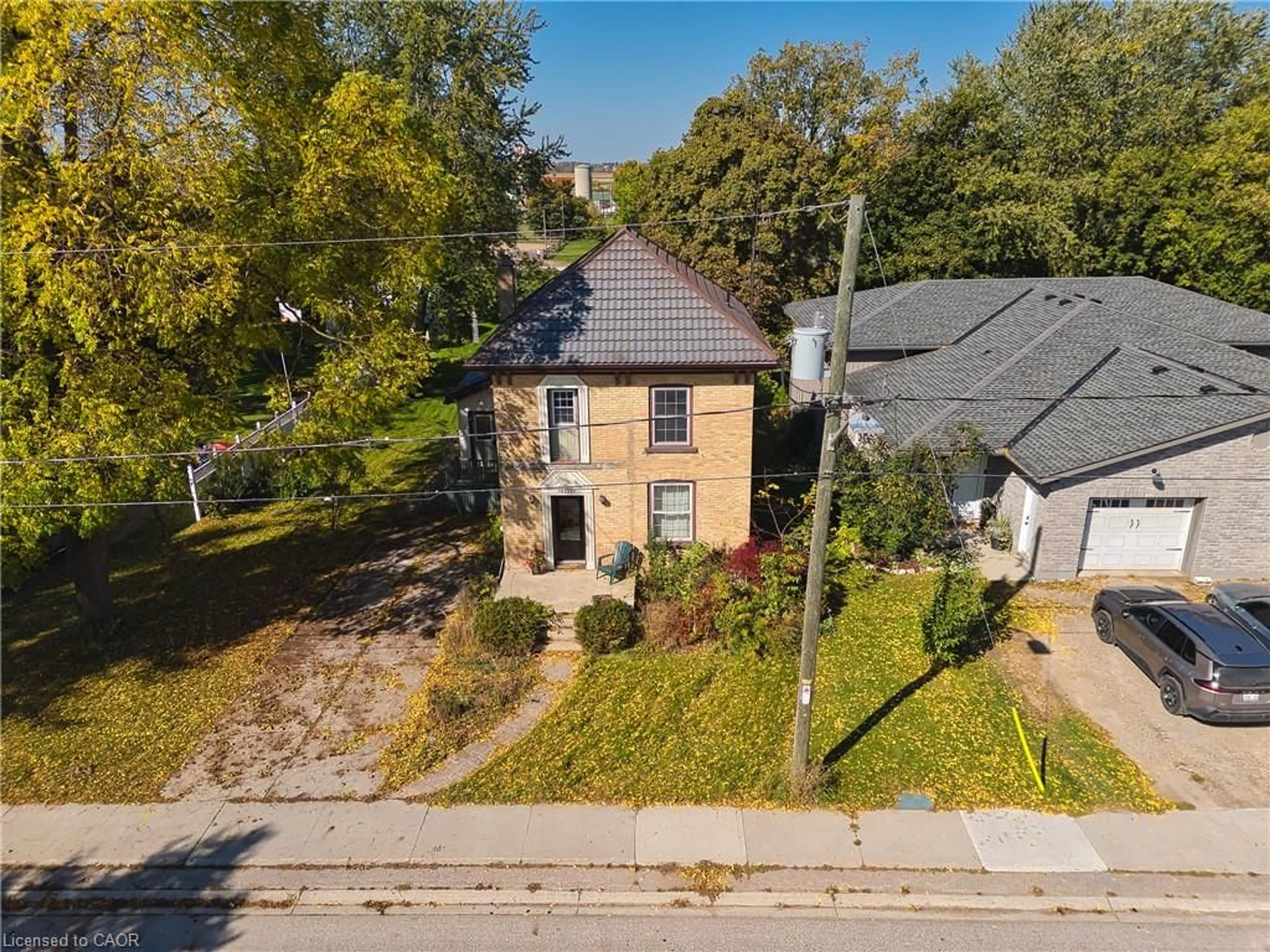 A pic from outside/outdoor area/front of a property/back of a property/a pic from drone, street for 12 Temperance St, Milverton Ontario N0K 1M0