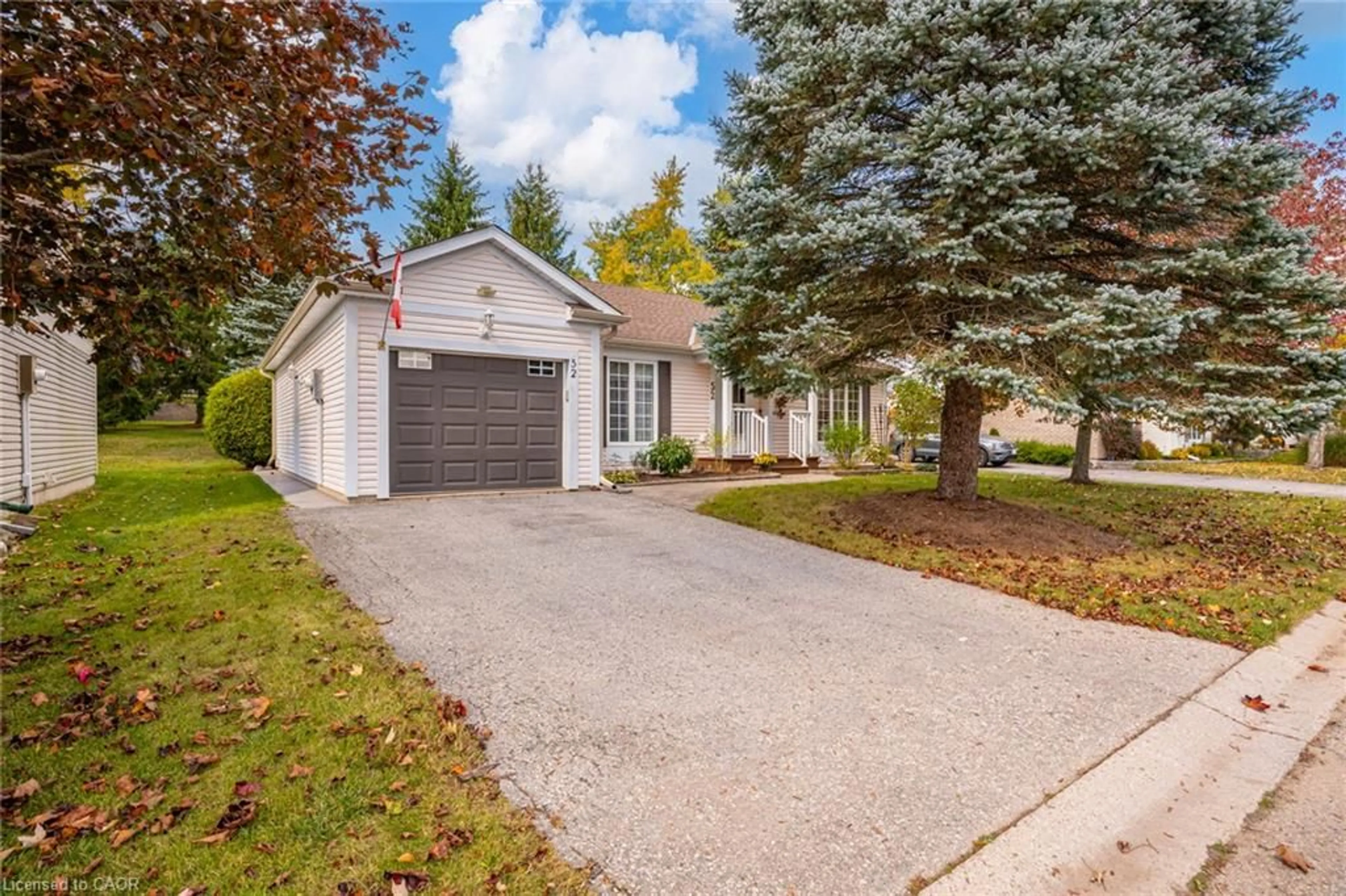 Home with vinyl exterior material, street for 52 Pine Ridge Rd, Wellington Ontario N0B 1J0