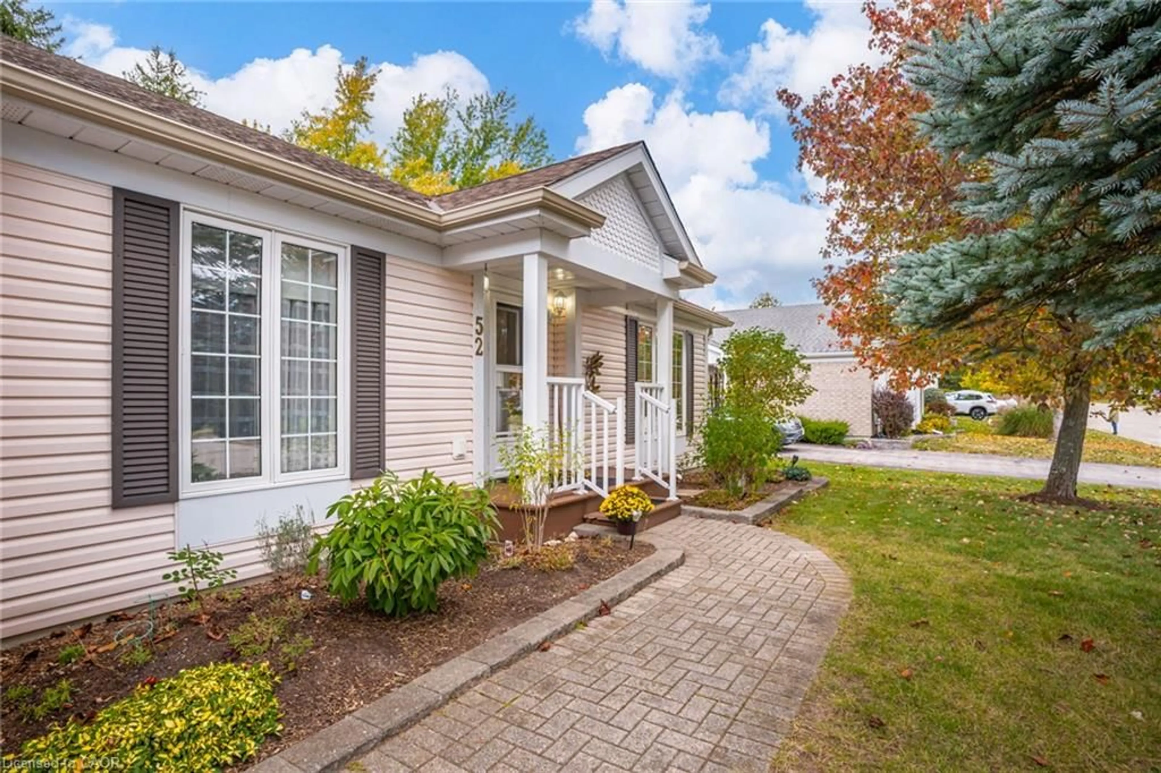 Home with vinyl exterior material, street for 52 Pine Ridge Rd, Wellington Ontario N0B 1J0