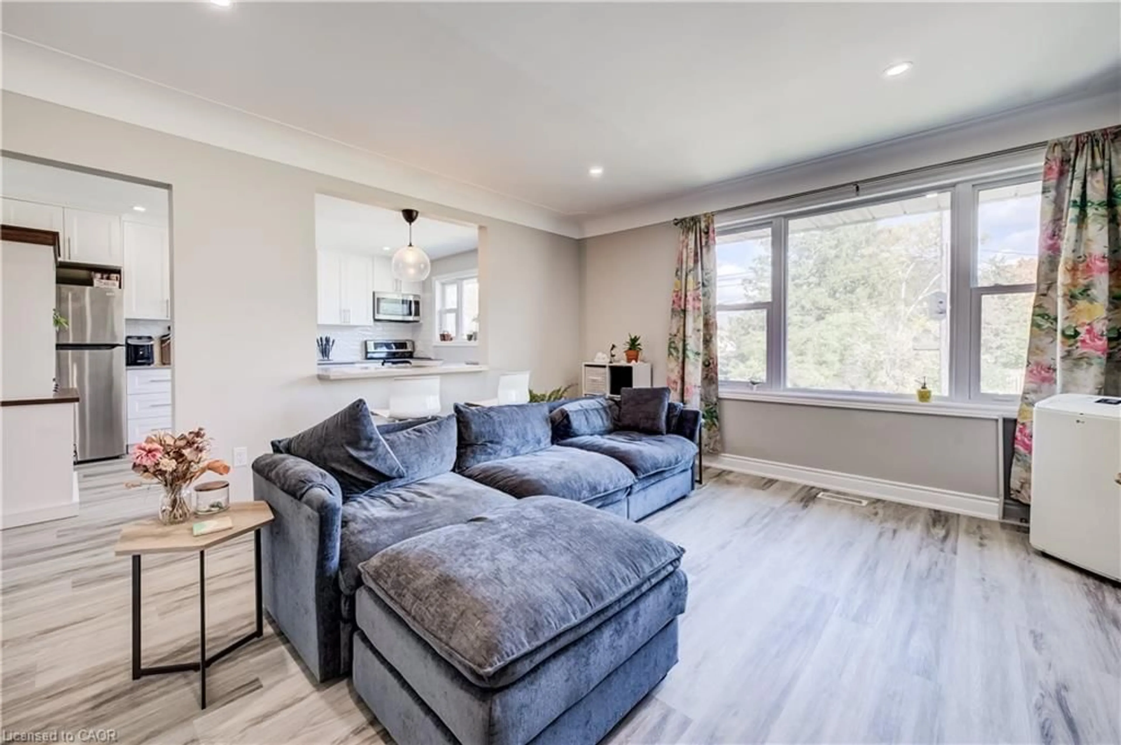 Living room with furniture, wood/laminate floor for 283 Becker St, Kitchener Ontario N2B 1X8