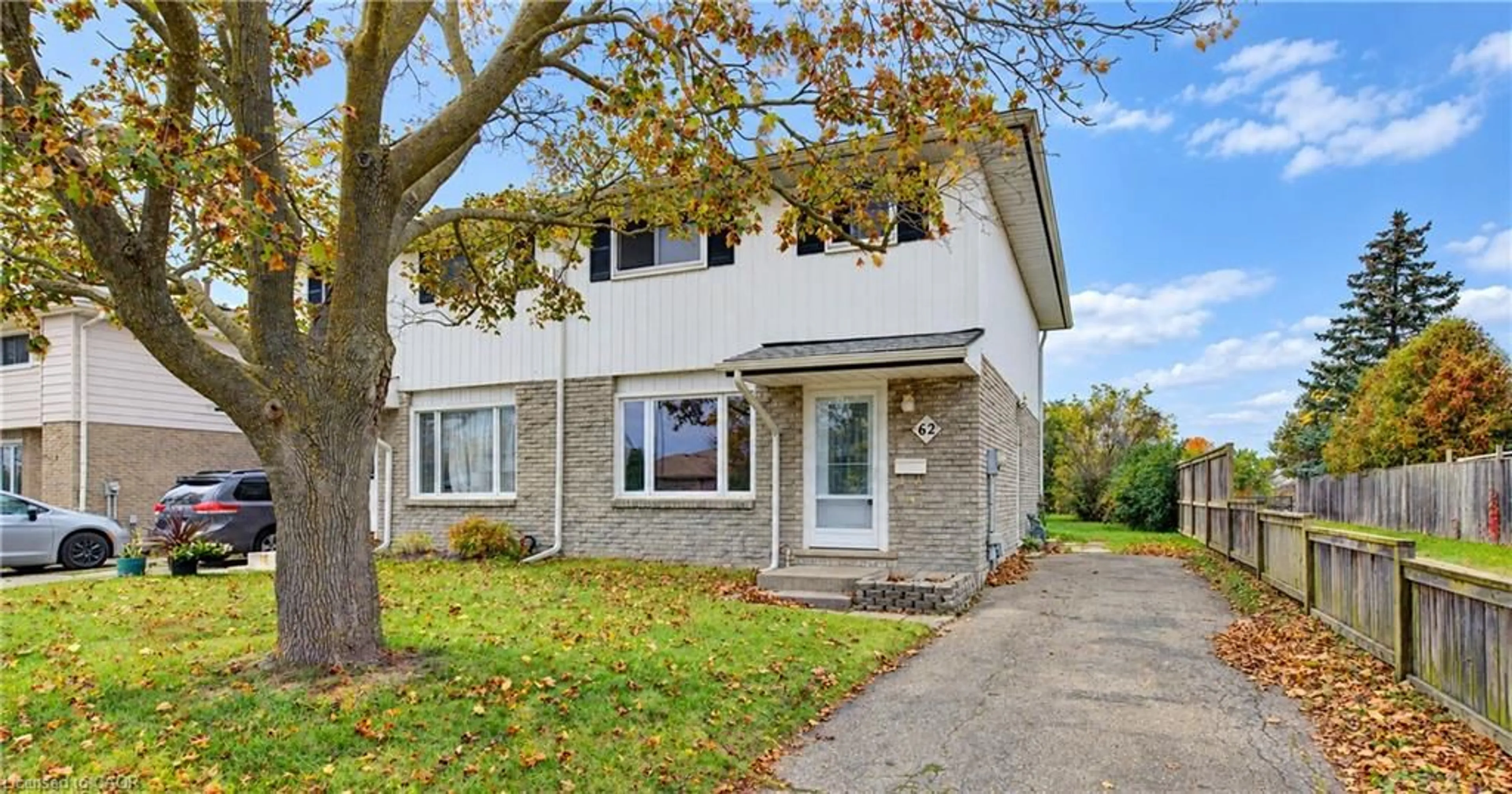 Home with brick exterior material, street for 62 The Country Way, Kitchener Ontario N2E 2K8