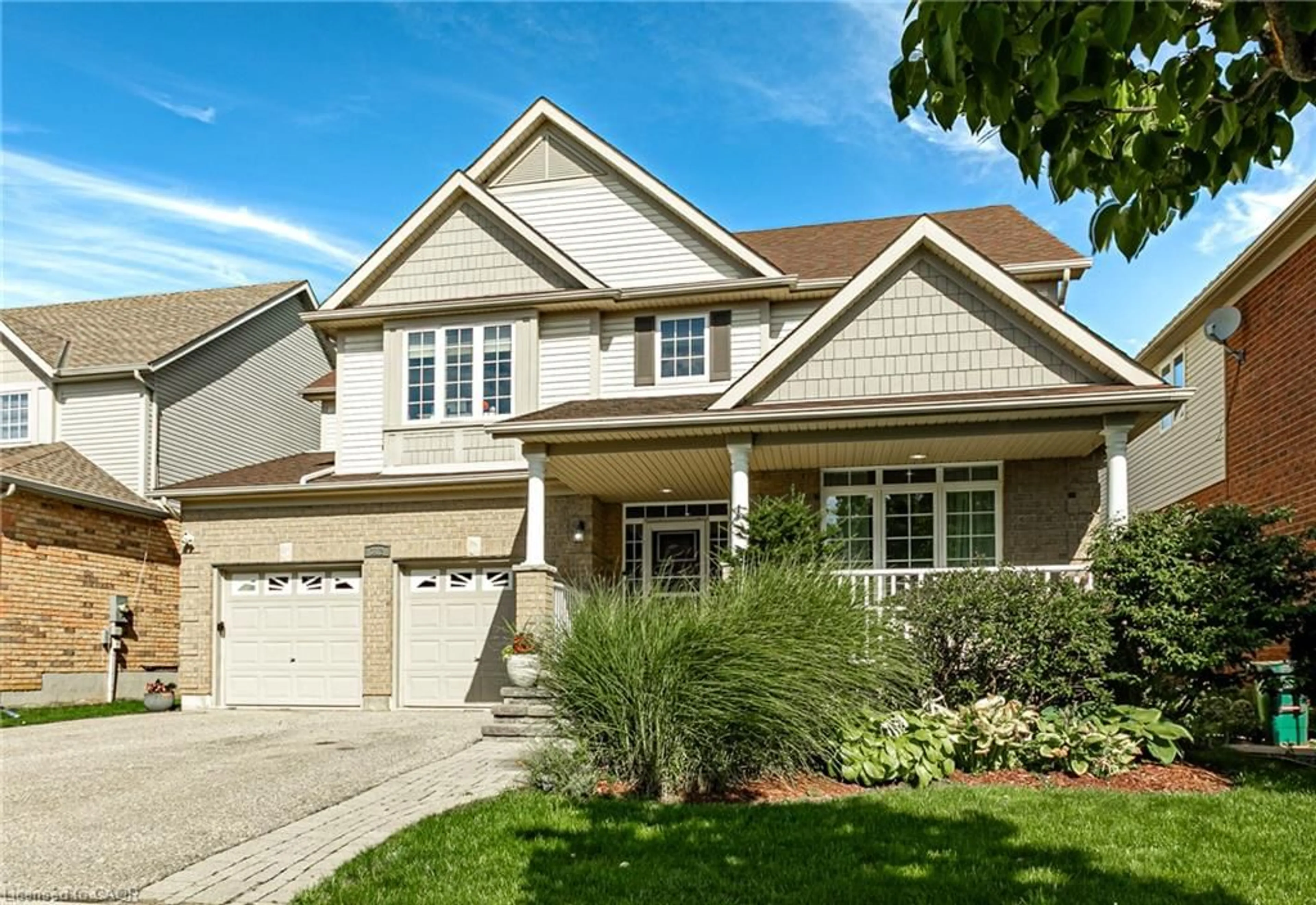 Home with vinyl exterior material, street for 312 Schooner Cres, Waterloo Ontario N2K 4M5