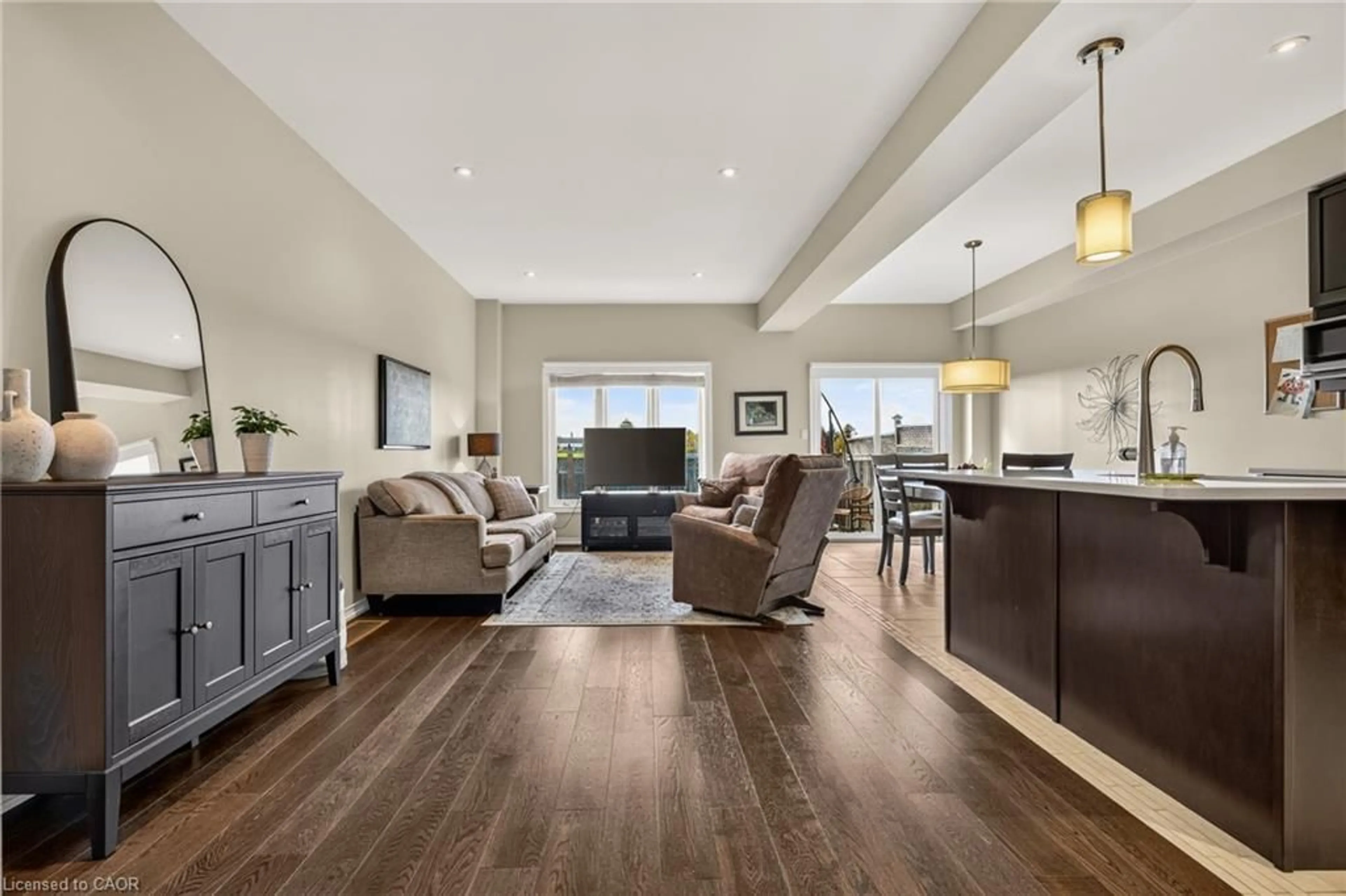 Living room with furniture, wood/laminate floor for 370 Stonehenge Dr #8, Ancaster Ontario L9K 0H9