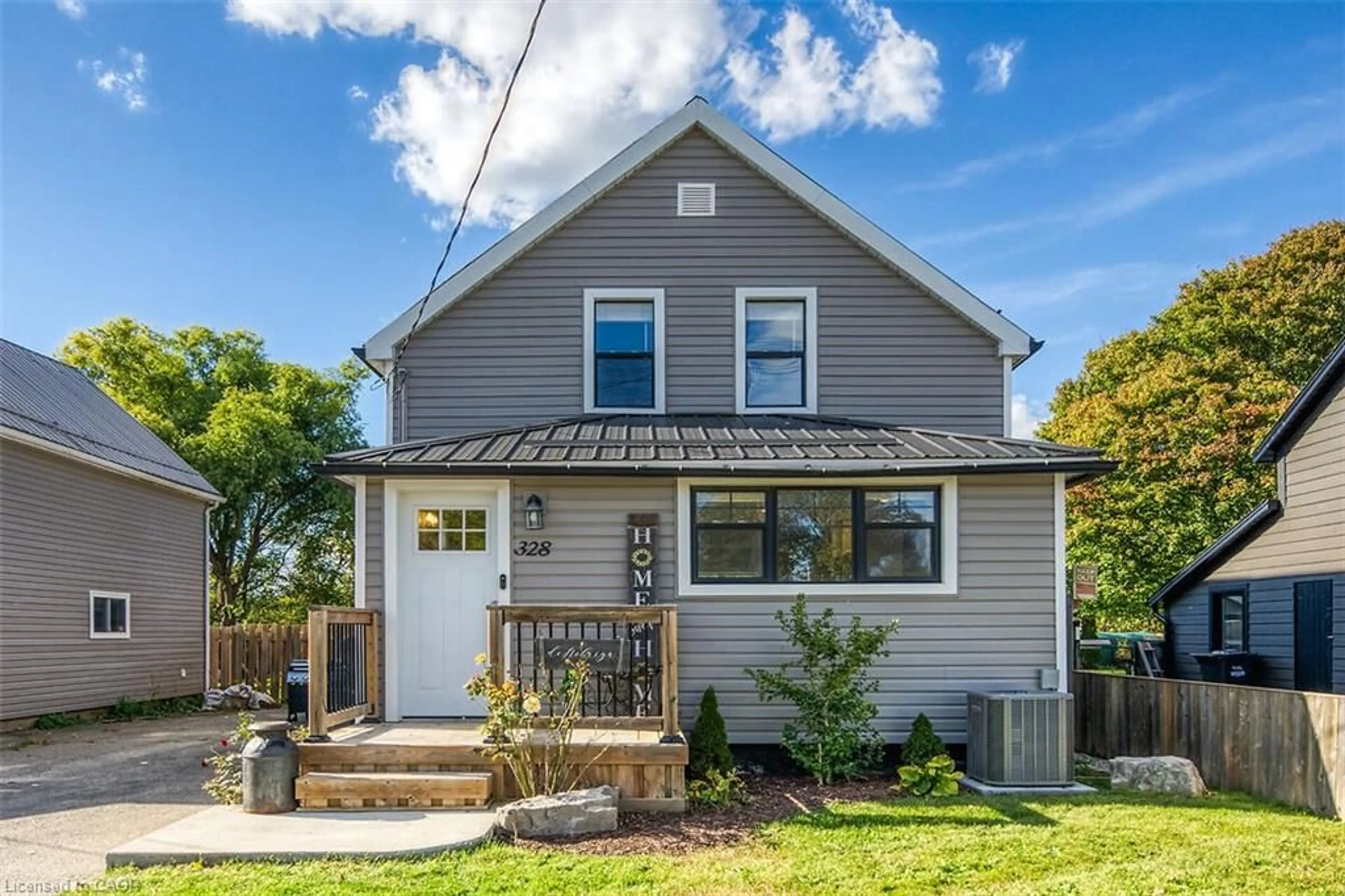 Home with vinyl exterior material, street for 328 Main St, Delhi Ontario N4B 2M7