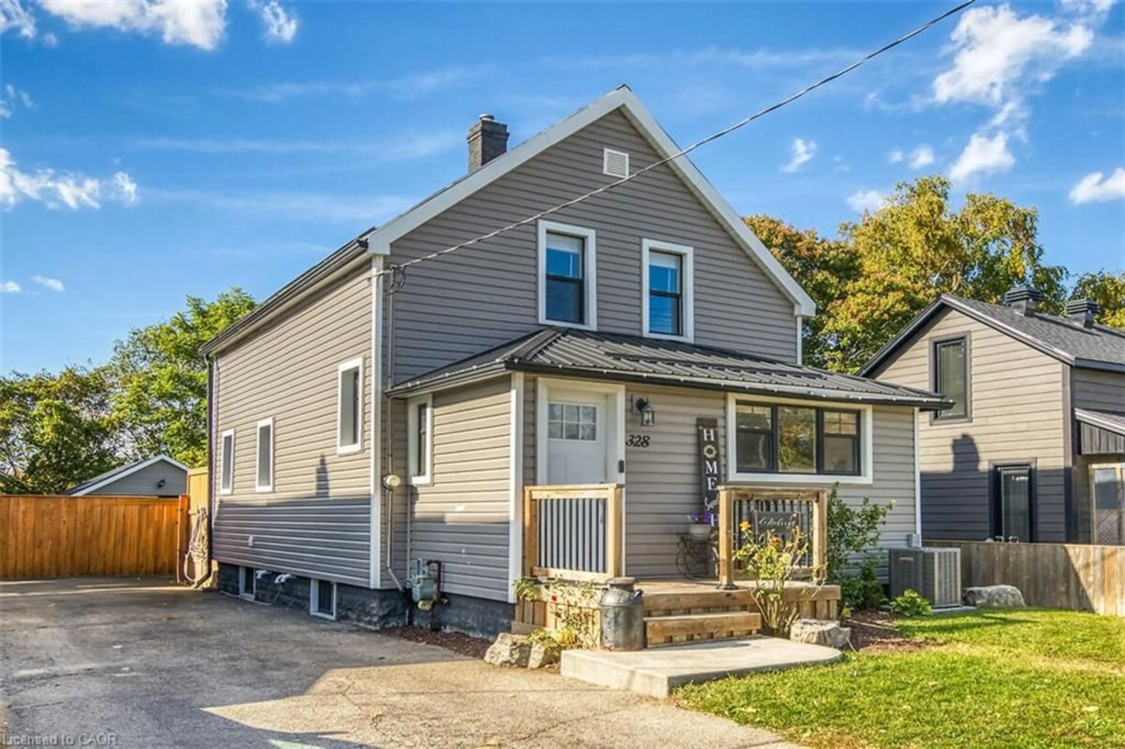 Home with vinyl exterior material, street for 328 Main St, Delhi Ontario N4B 2M7