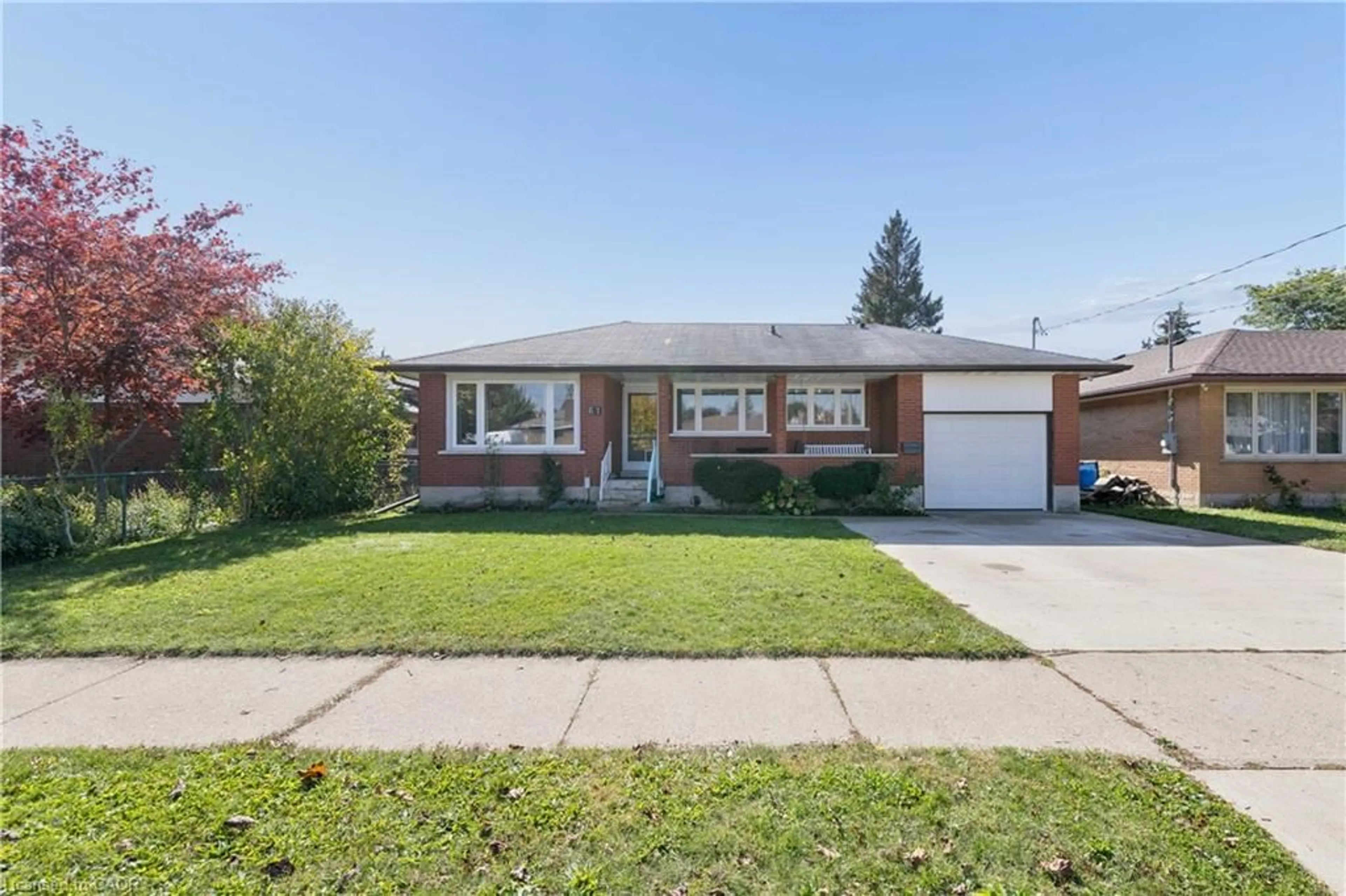 Home with brick exterior material, street for 61 Fairlawn Rd, Kitchener Ontario N2C 1X8