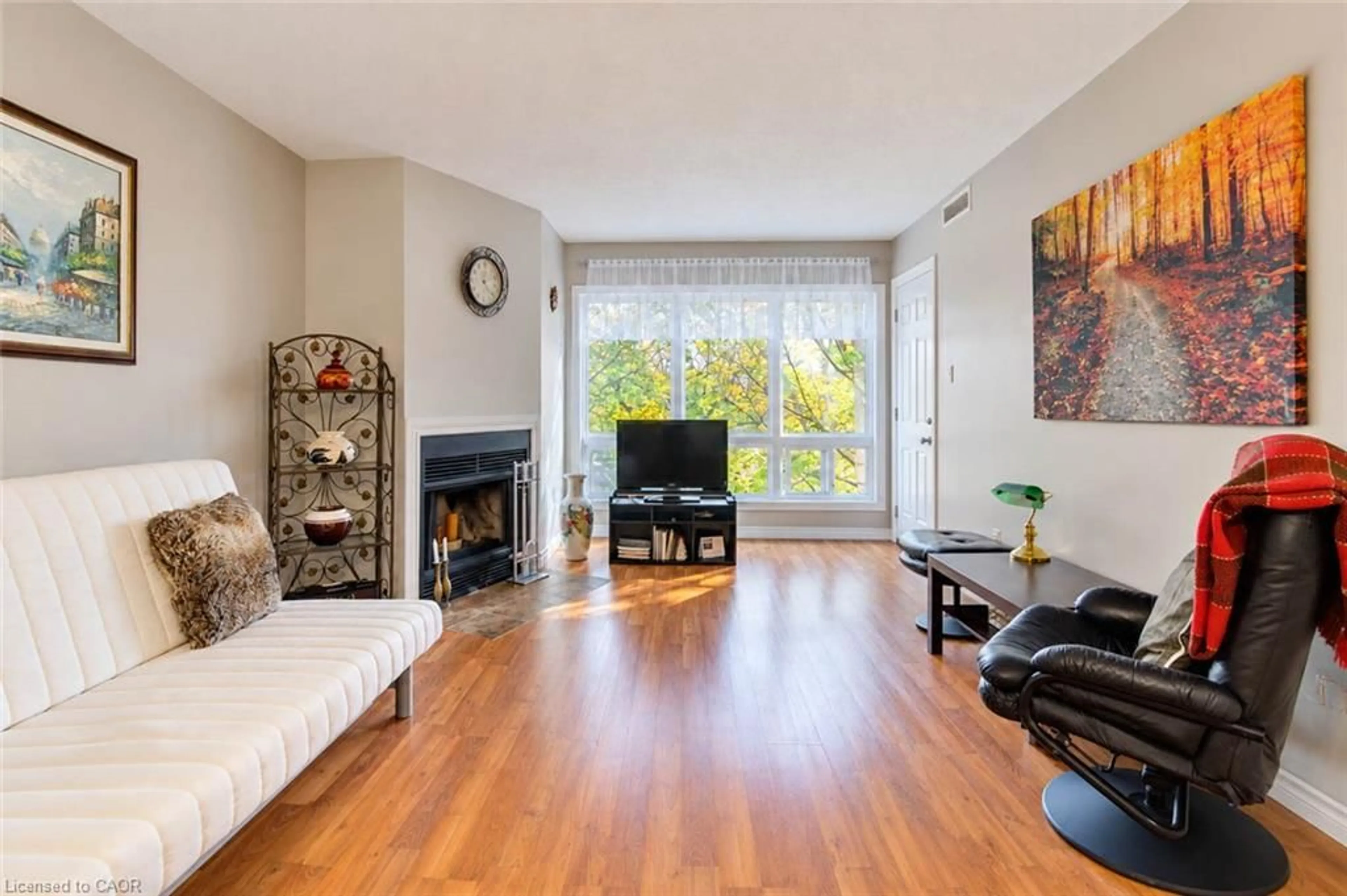 Living room with furniture, wood/laminate floor for 15 Hofstetter Ave #306, Kitchener Ontario N2A 3Z7