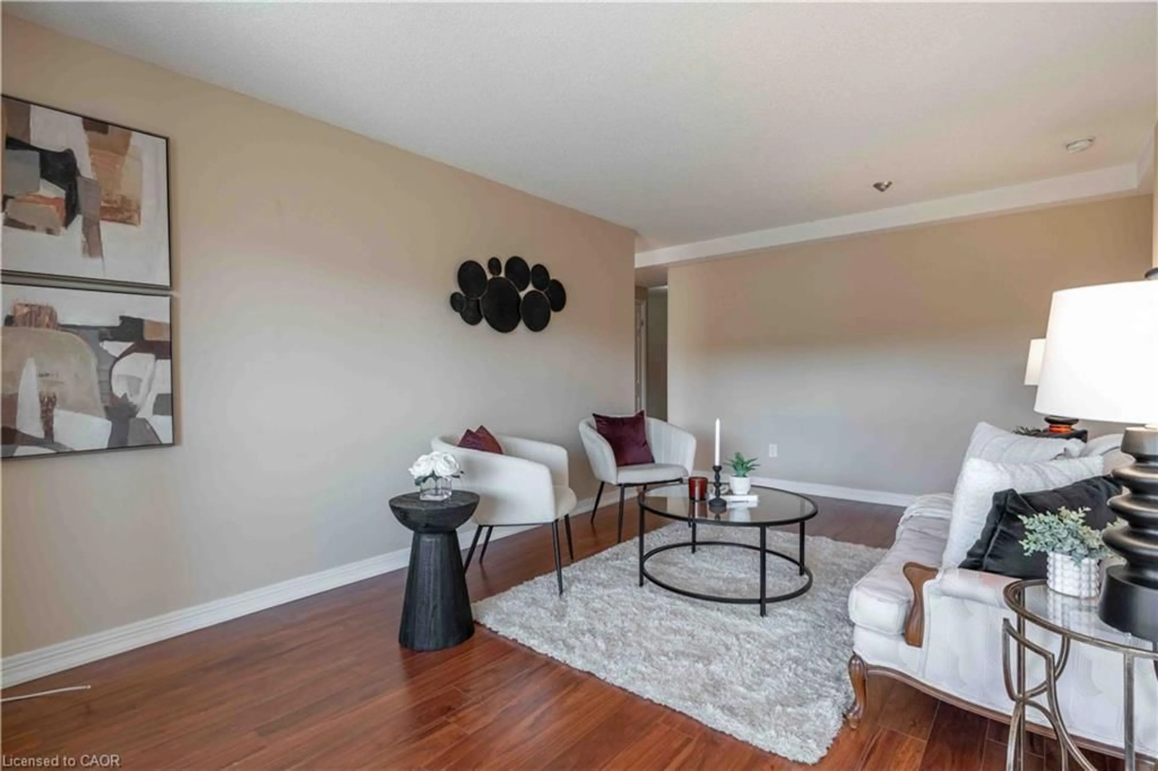 Living room with furniture, wood/laminate floor for 606 Village Green Blvd #6, Stoney Creek Ontario L8G 5B7