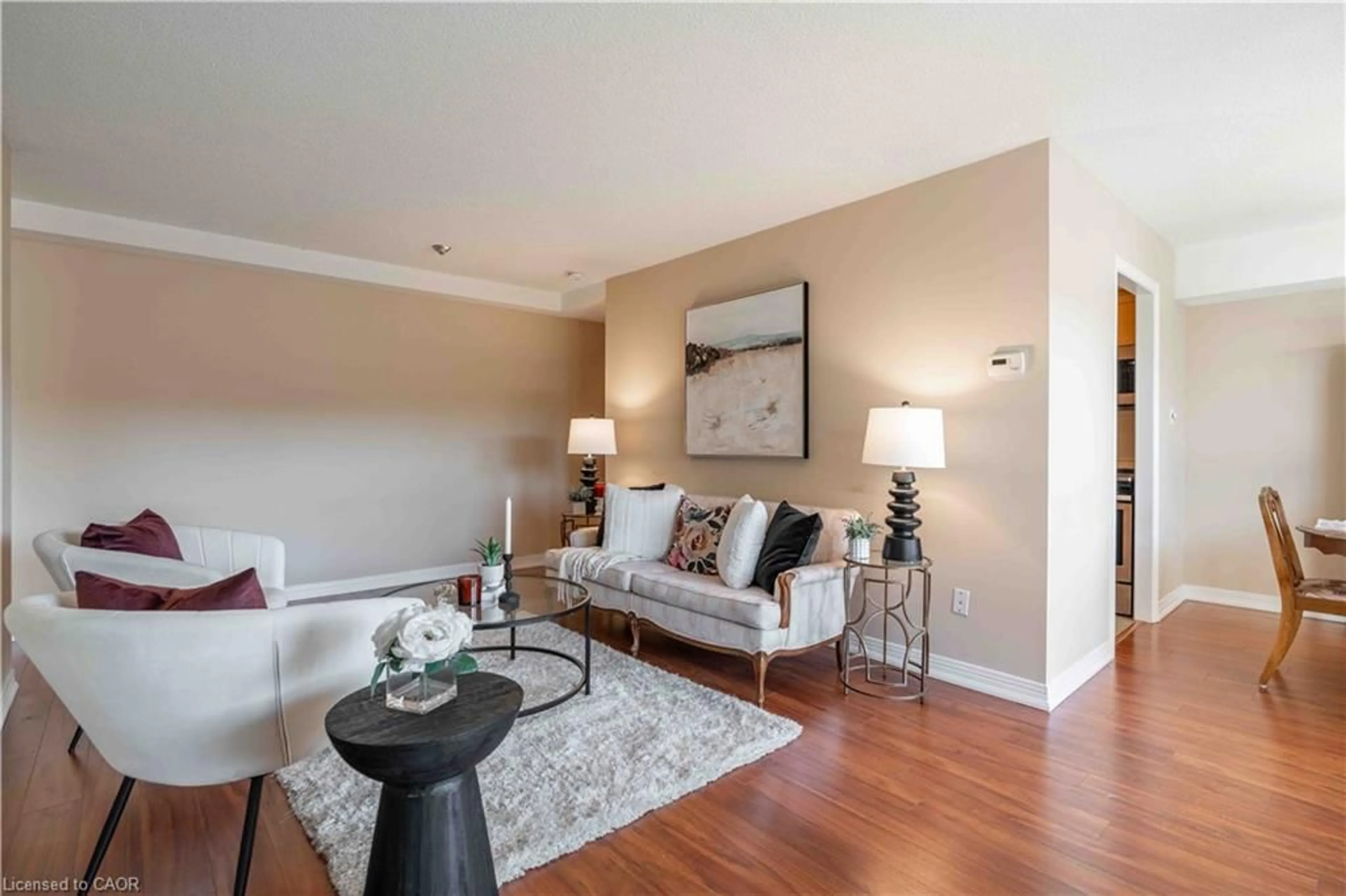 Living room with furniture, wood/laminate floor for 606 Village Green Blvd #6, Stoney Creek Ontario L8G 5B7
