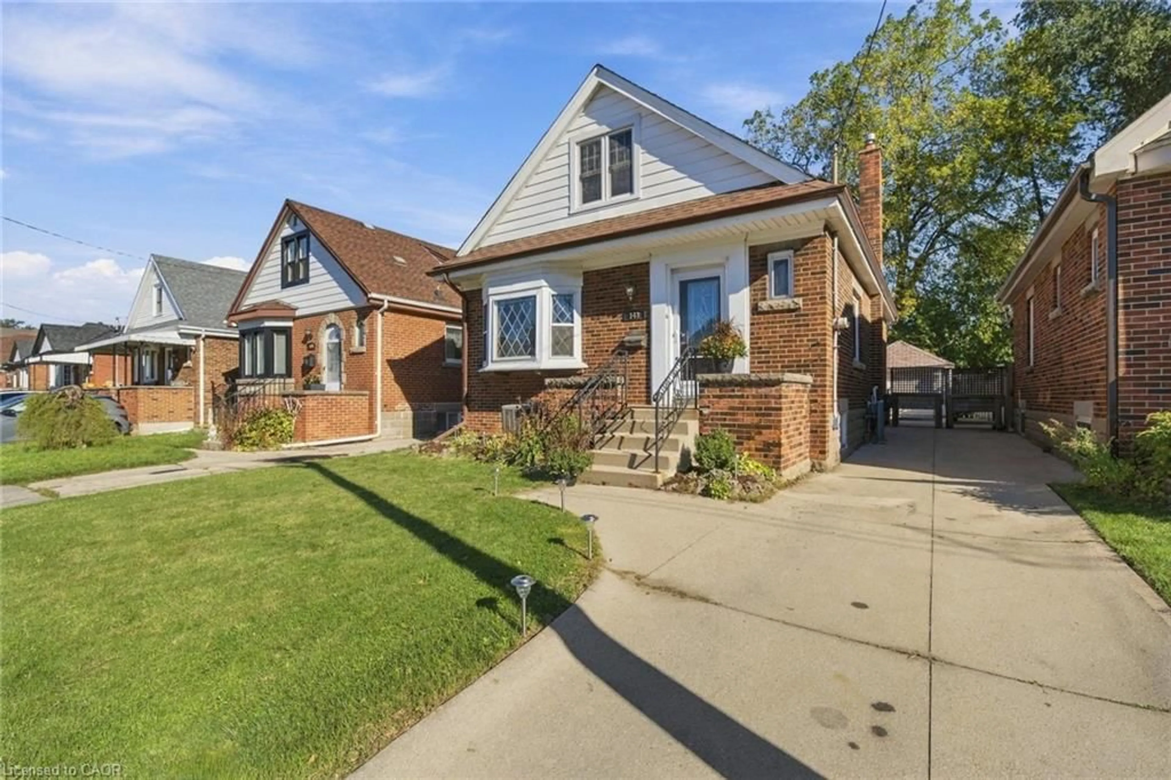 Home with brick exterior material, street for 143 Huxley Ave, Hamilton Ontario L8K 2P9