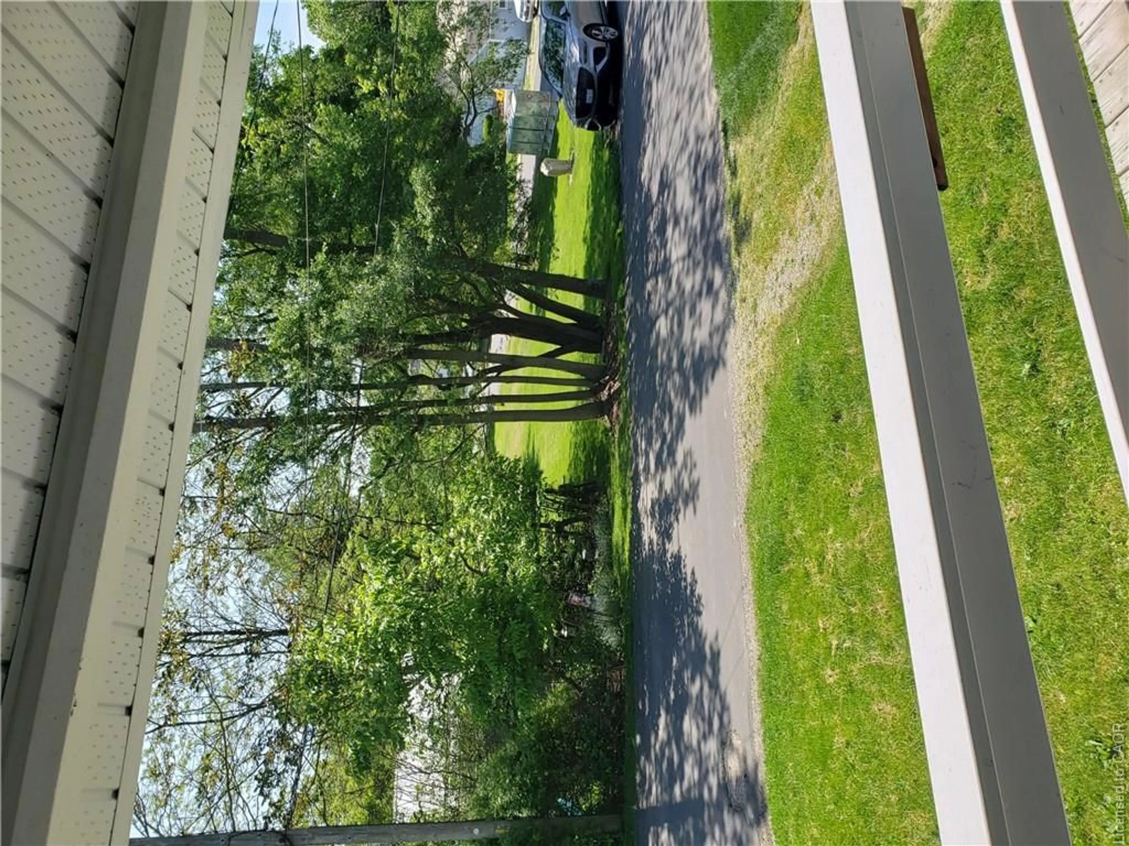 A pic from outside/outdoor area/front of a property/back of a property/a pic from drone, forest/trees view for 234 Cornell Dr, Port Stanley Ontario N5L 1A5