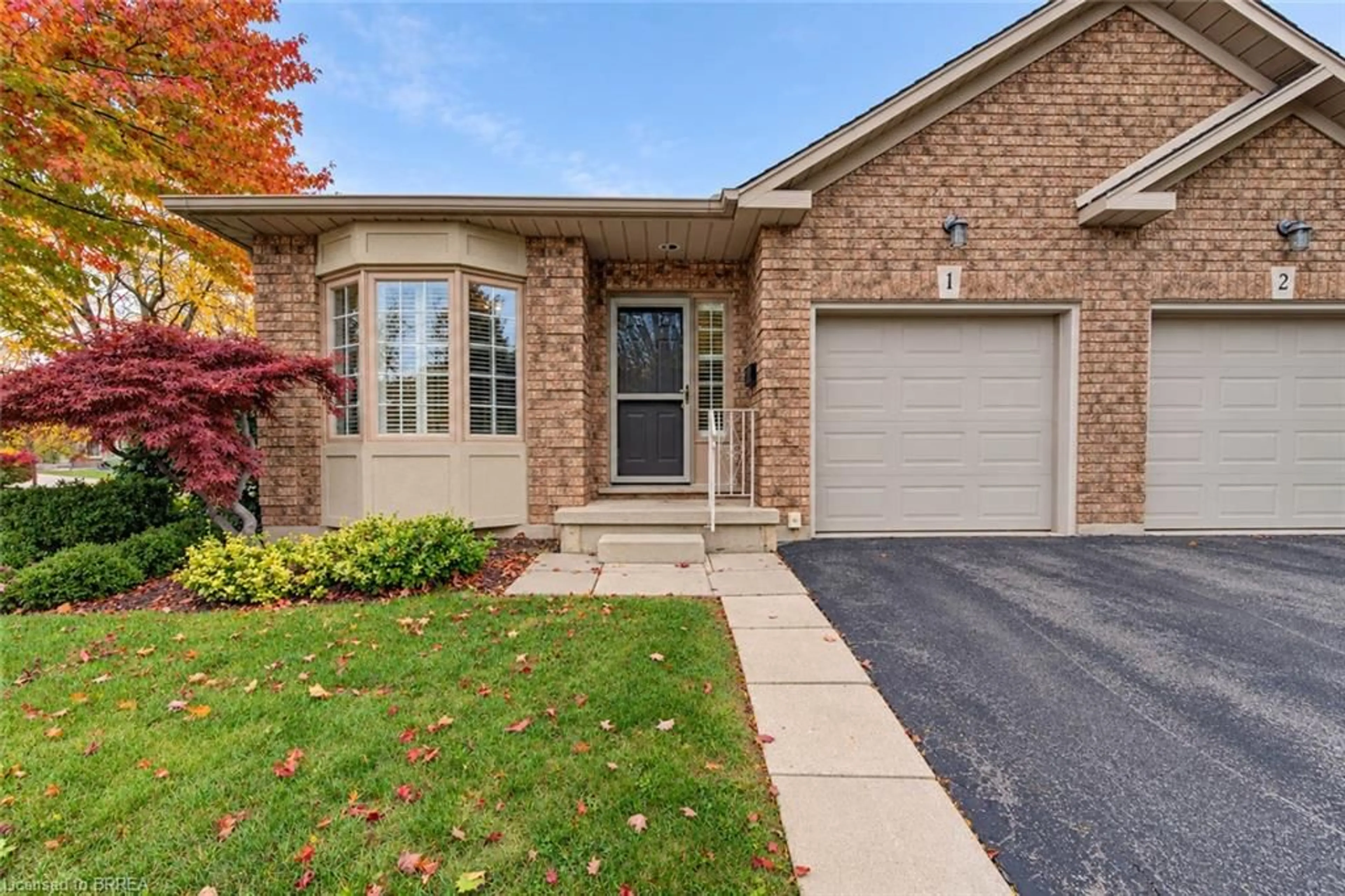 Home with brick exterior material, street for 10 Courtland Dr #1, Brantford Ontario N3R 7Y2