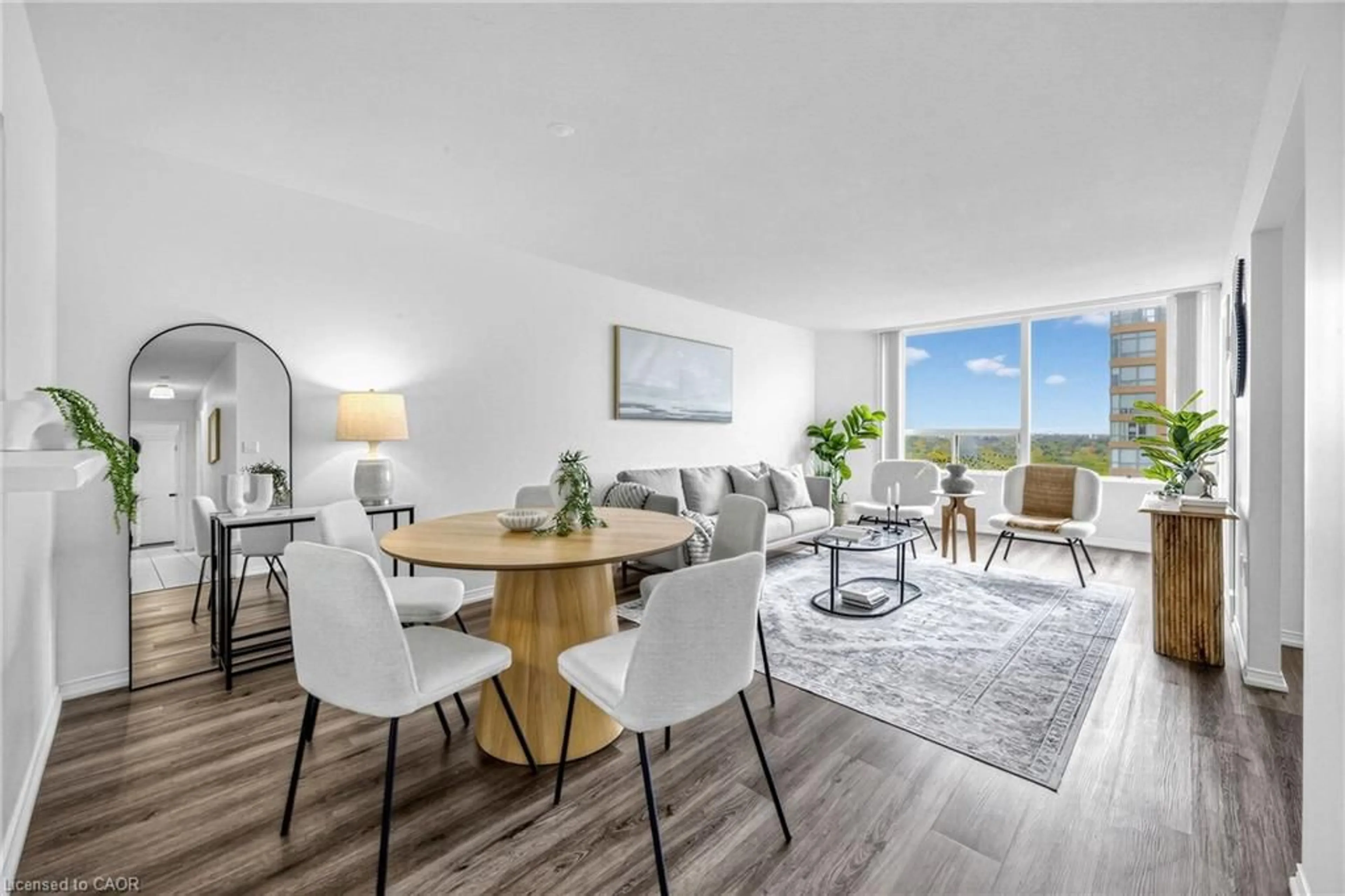 Living room with furniture, wood/laminate floor for 1270 Maple Crossing Blvd #1705, Burlington Ontario L7S 2J3