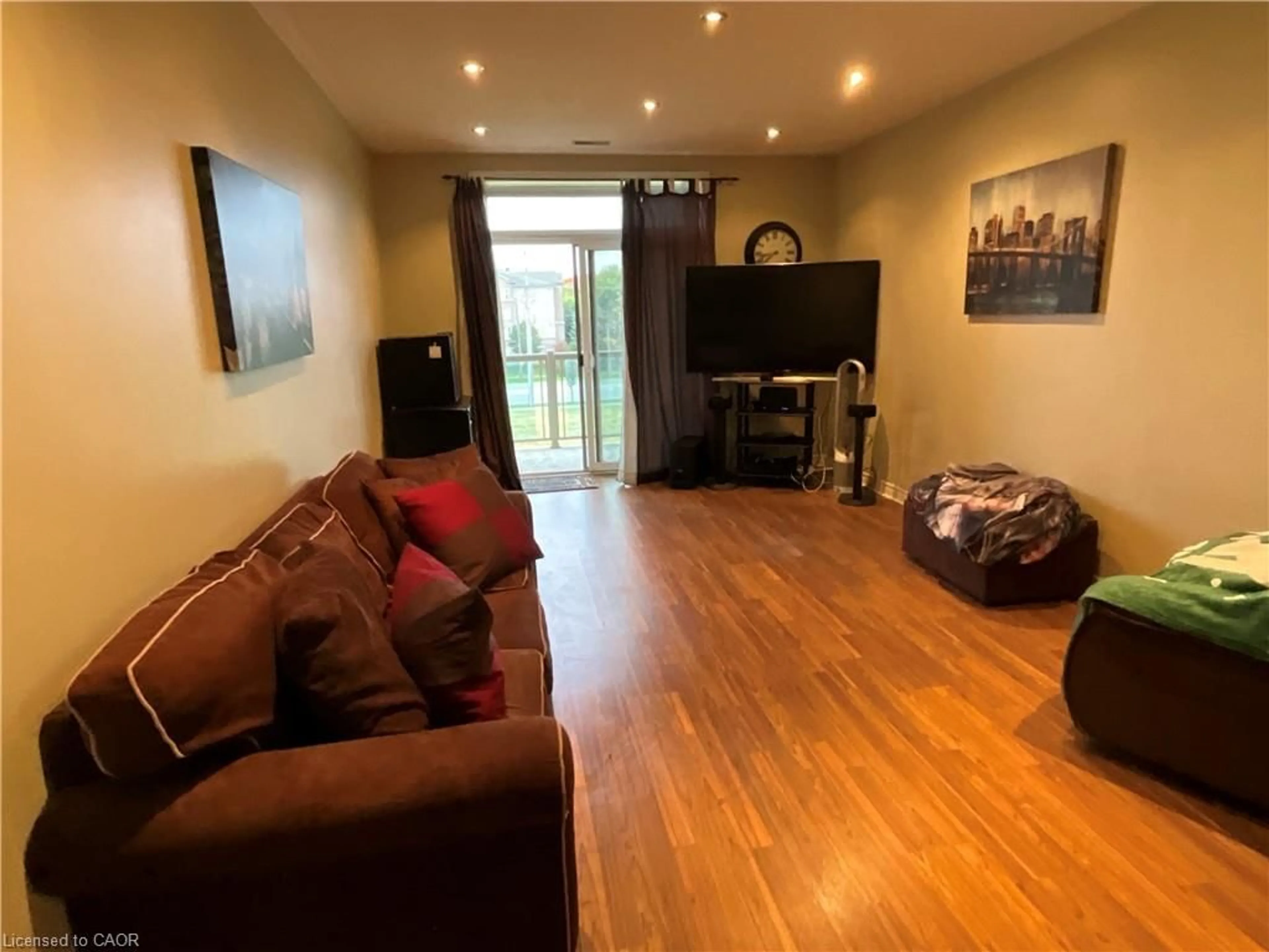 Living room with furniture, wood/laminate floor for 1980 Imperial Way #317, Burlington Ontario L7L 0E7