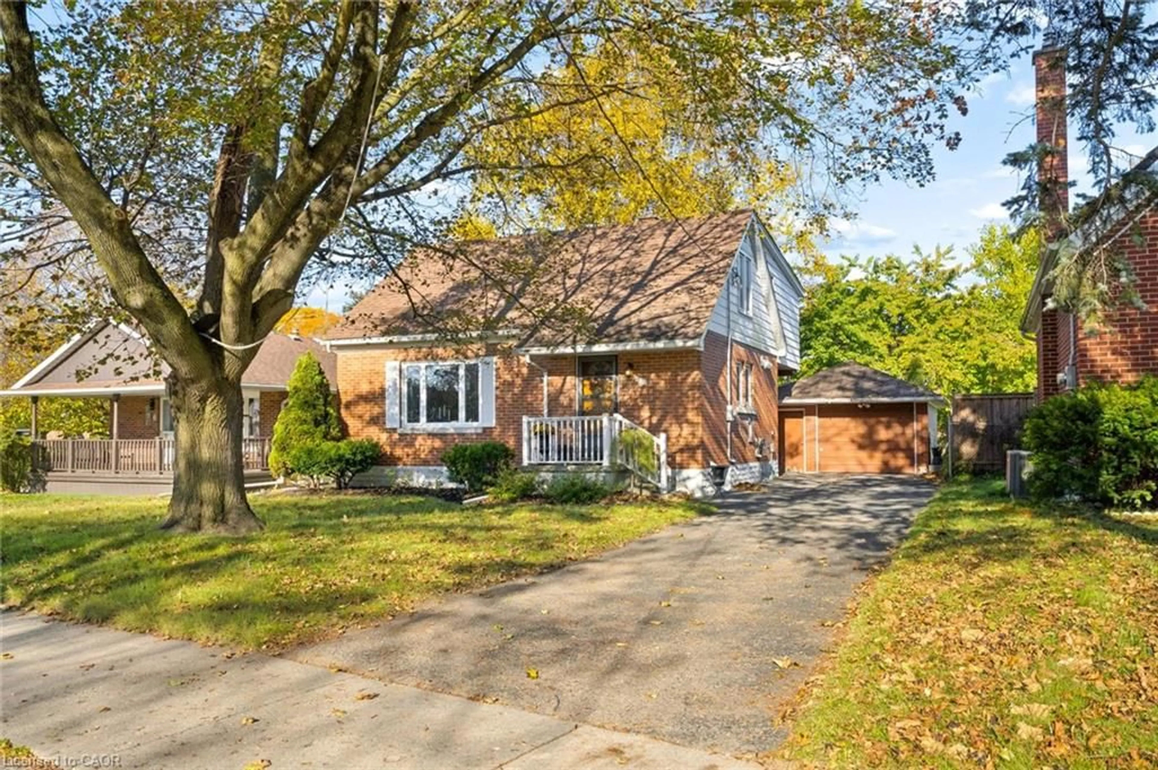 Home with brick exterior material, street for 12 Layton St, Kitchener Ontario N2B 1H2