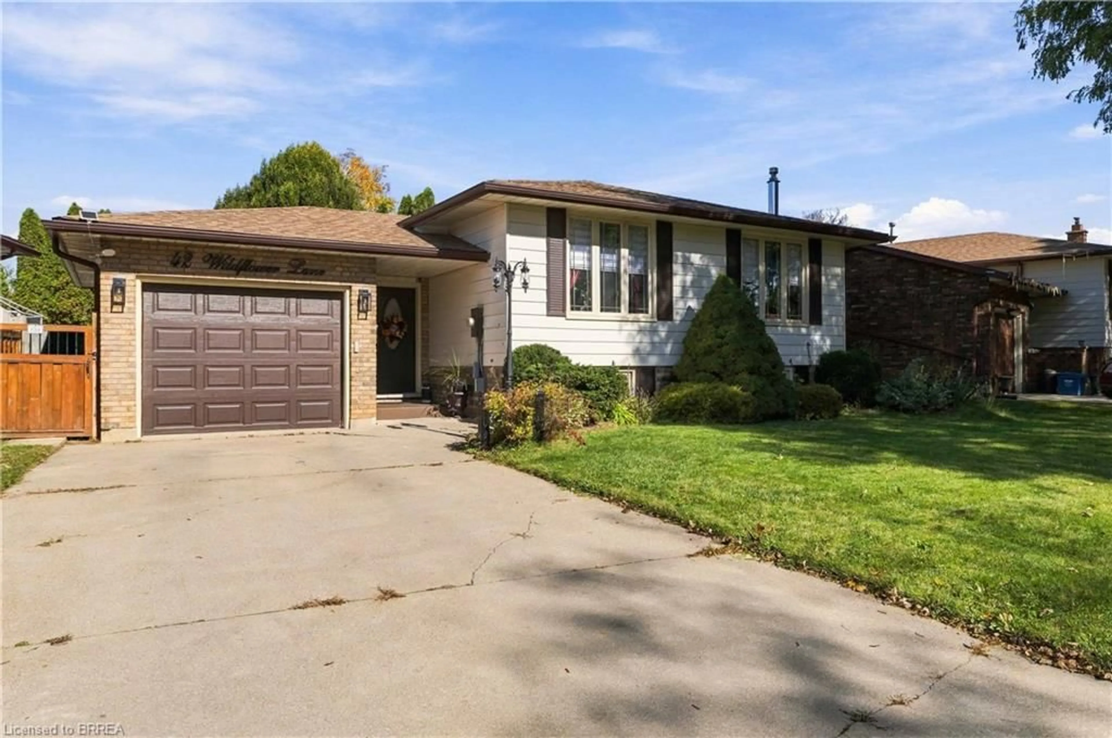 Home with brick exterior material, street for 42 Wildflower Lane, Brantford Ontario N3R 7H6
