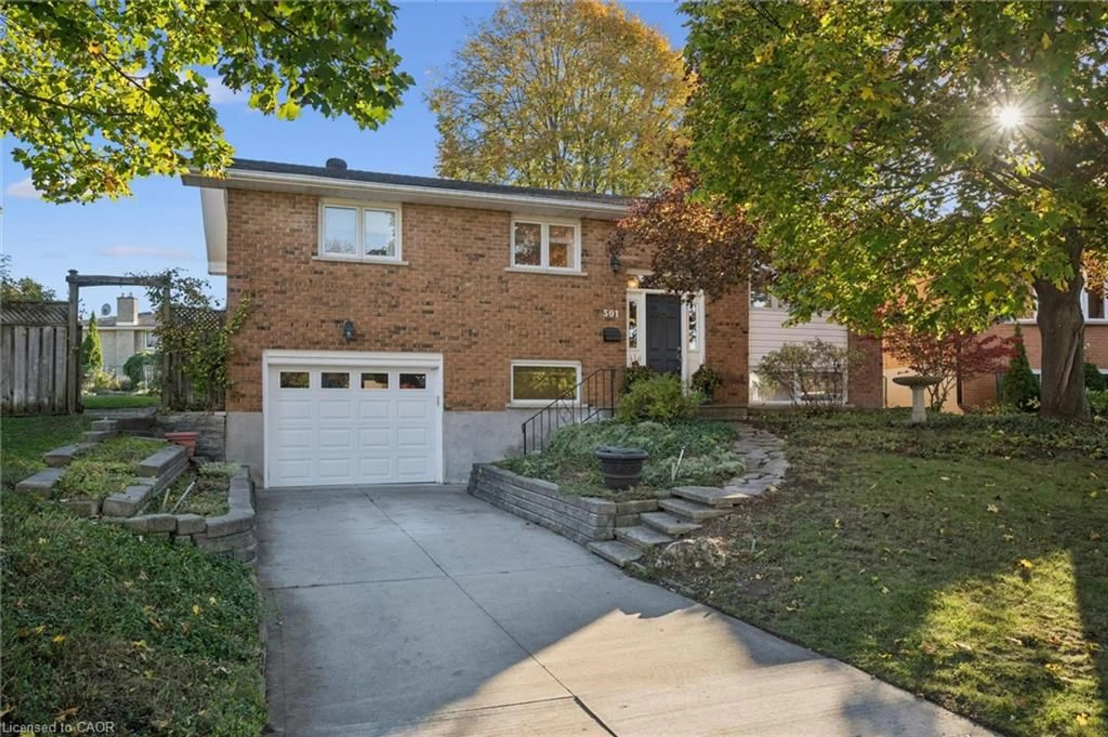 Home with brick exterior material, street for 301 Martindale Cres, Waterloo Ontario N2L 4M8