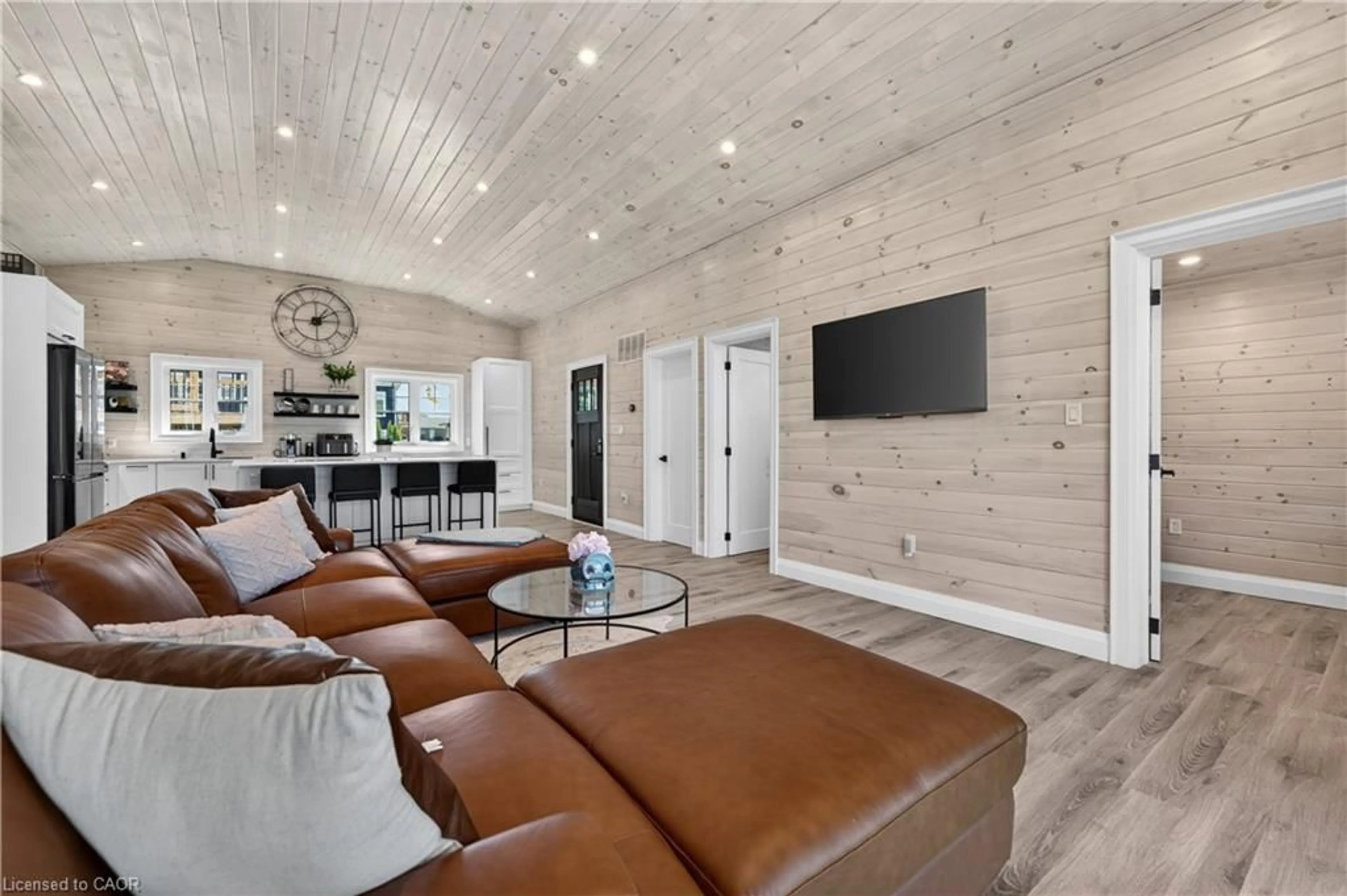 Living room with furniture, wood/laminate floor for 71865 Sunview Ave, Dashwood Ontario N0M 1N0