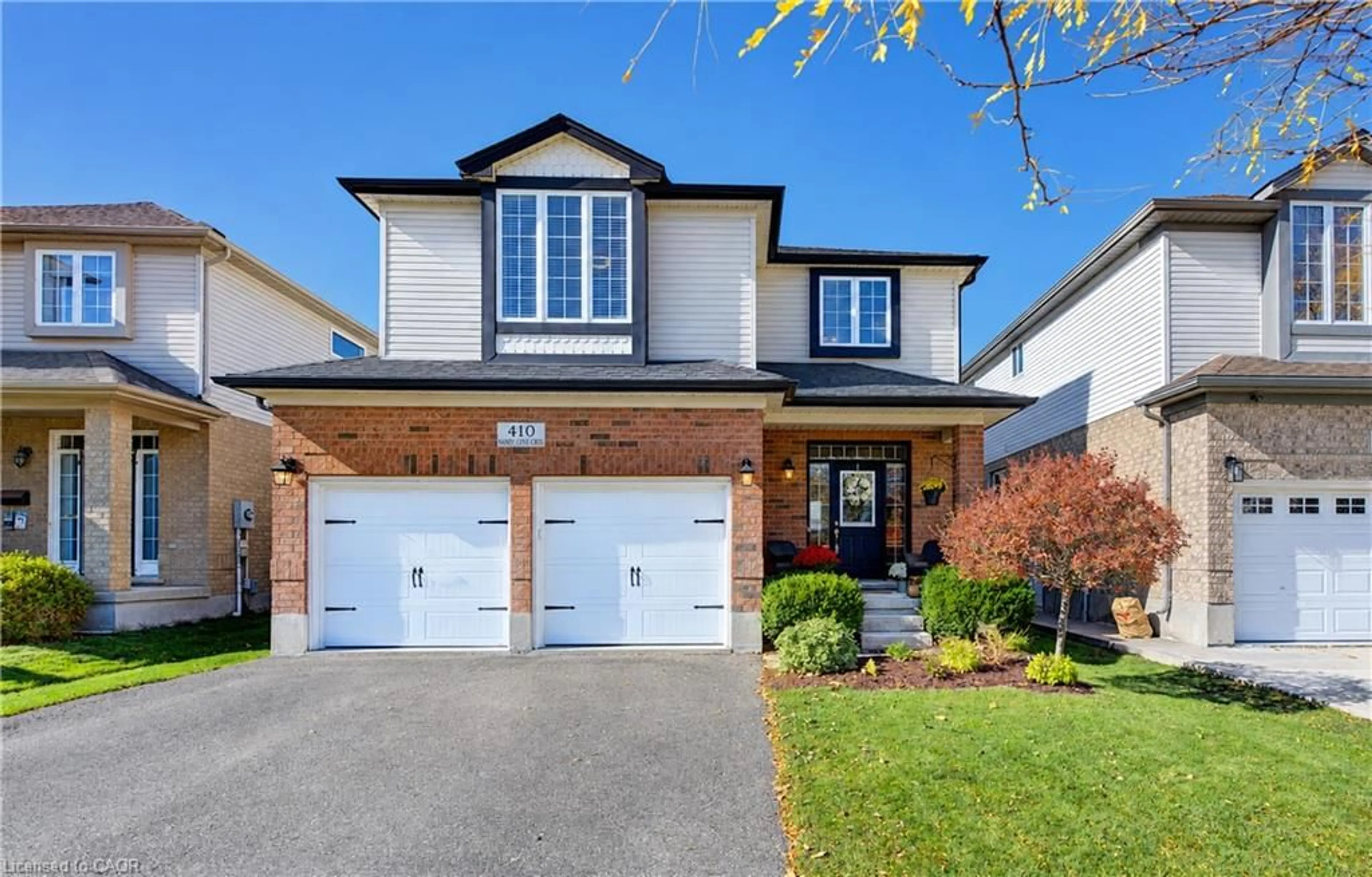 Home with brick exterior material, street for 410 Sandy Cove Cres, Waterloo Ontario N2K 4G6