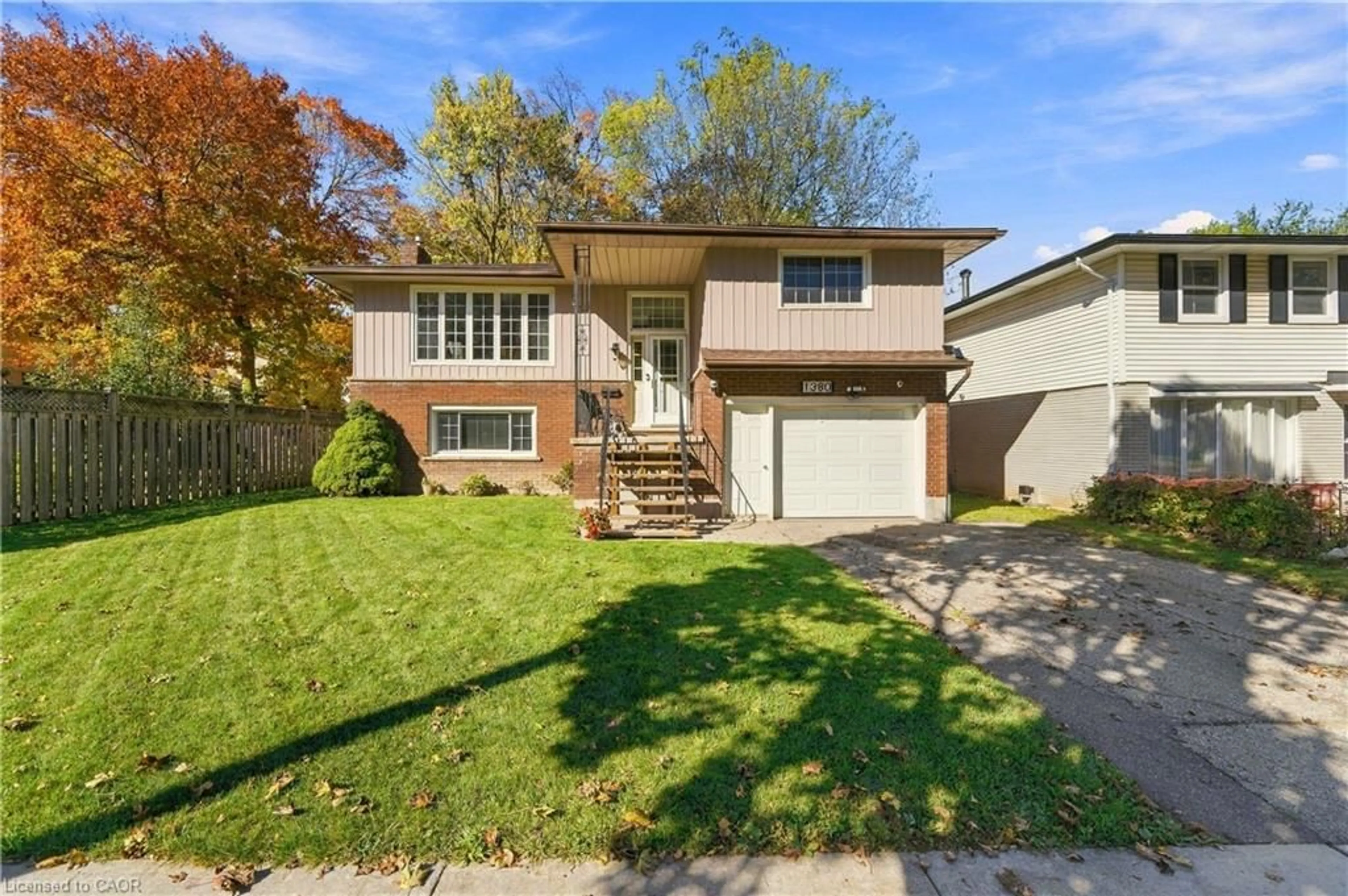 Home with vinyl exterior material, street for 1380 Queen's Blvd, Kitchener Ontario N2M 1C8
