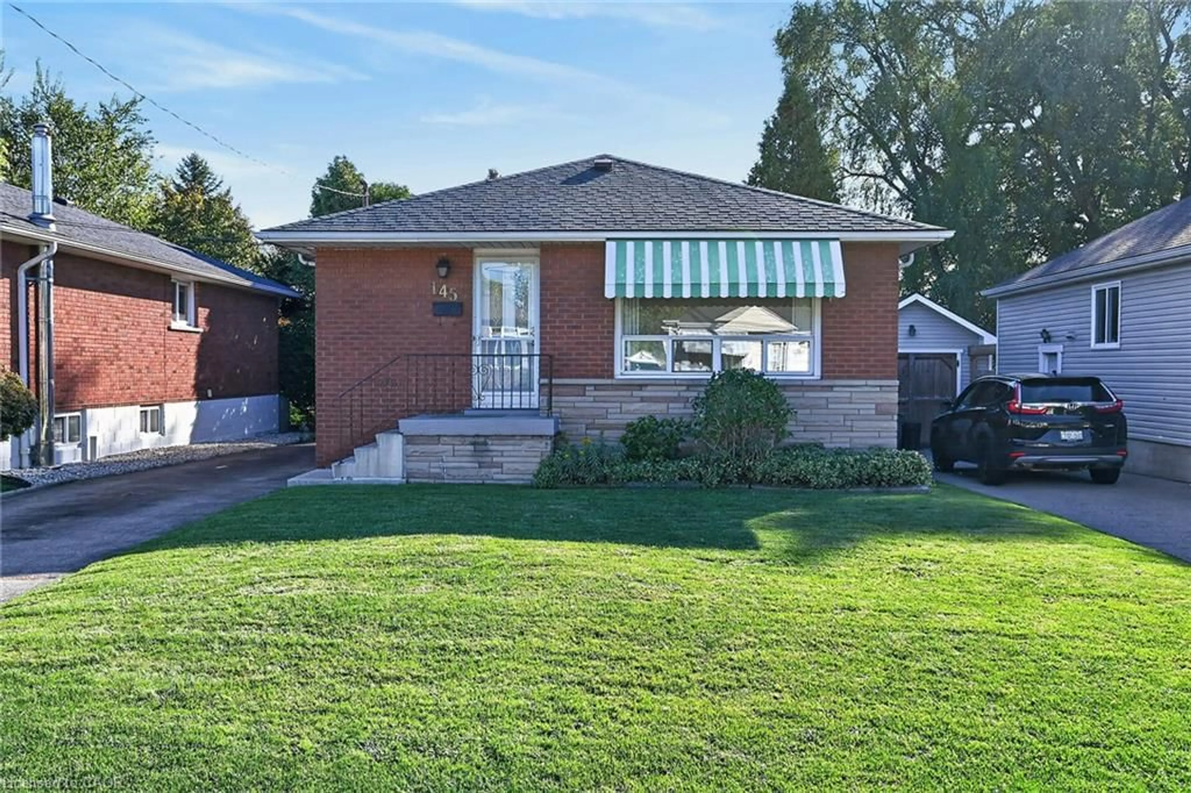 Home with brick exterior material, street for 145 East 25th St, Hamilton Ontario L8V 3A3