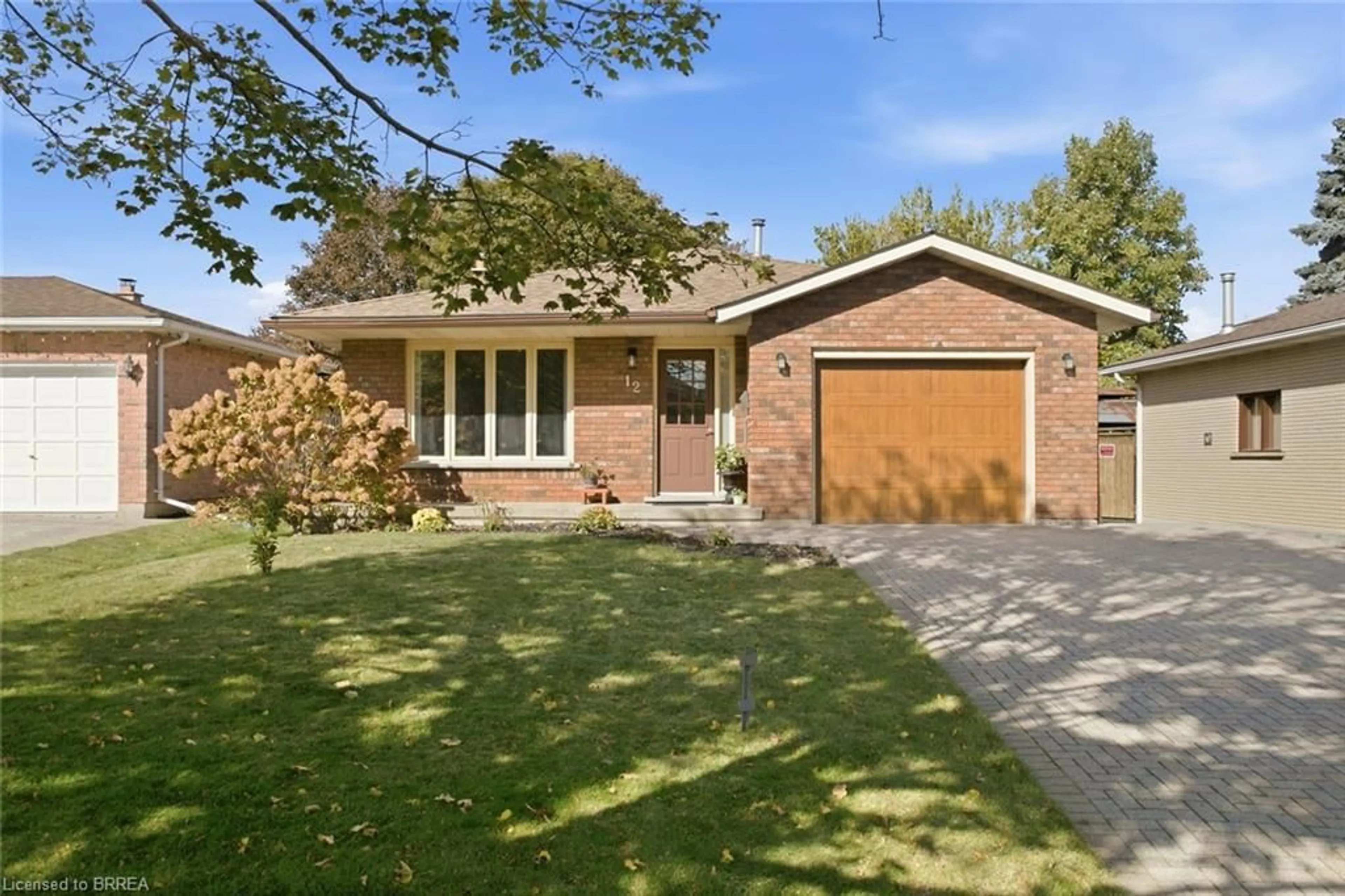 Home with brick exterior material, street for 12 Spartan Dr, Brantford Ontario N3R 6C7