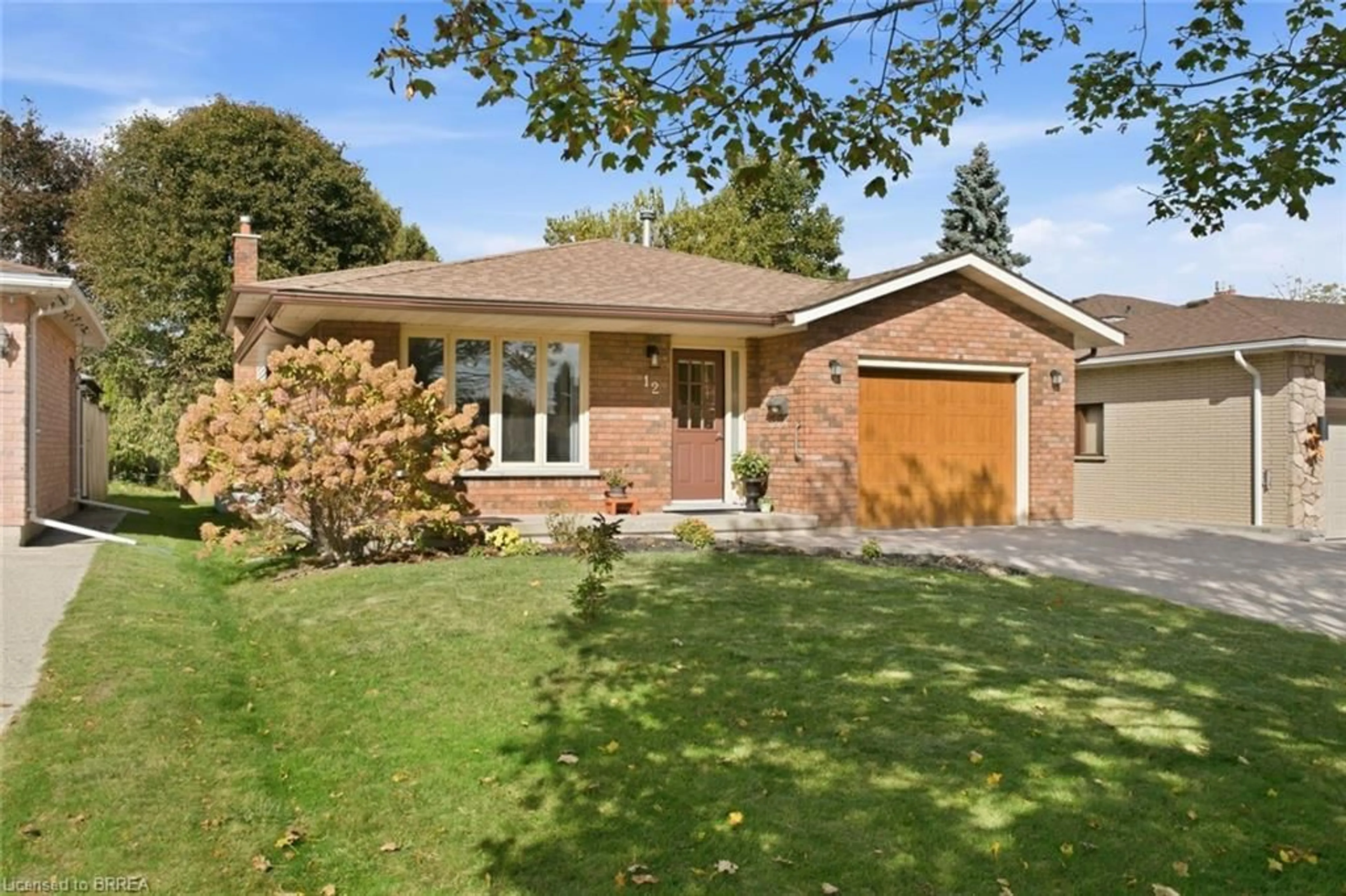 Home with brick exterior material, street for 12 Spartan Dr, Brantford Ontario N3R 6C7