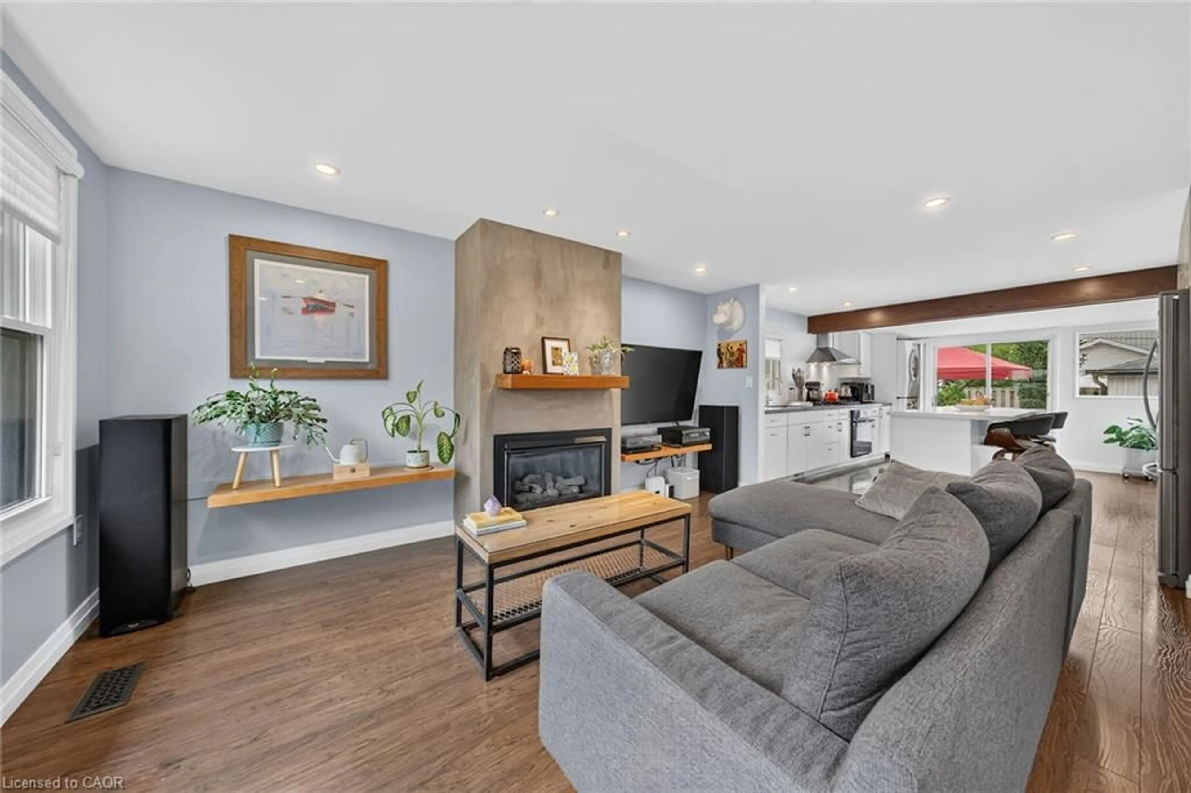 Living room with furniture, wood/laminate floor for 271 Julian Ave, Hamilton Ontario L8H 5S3