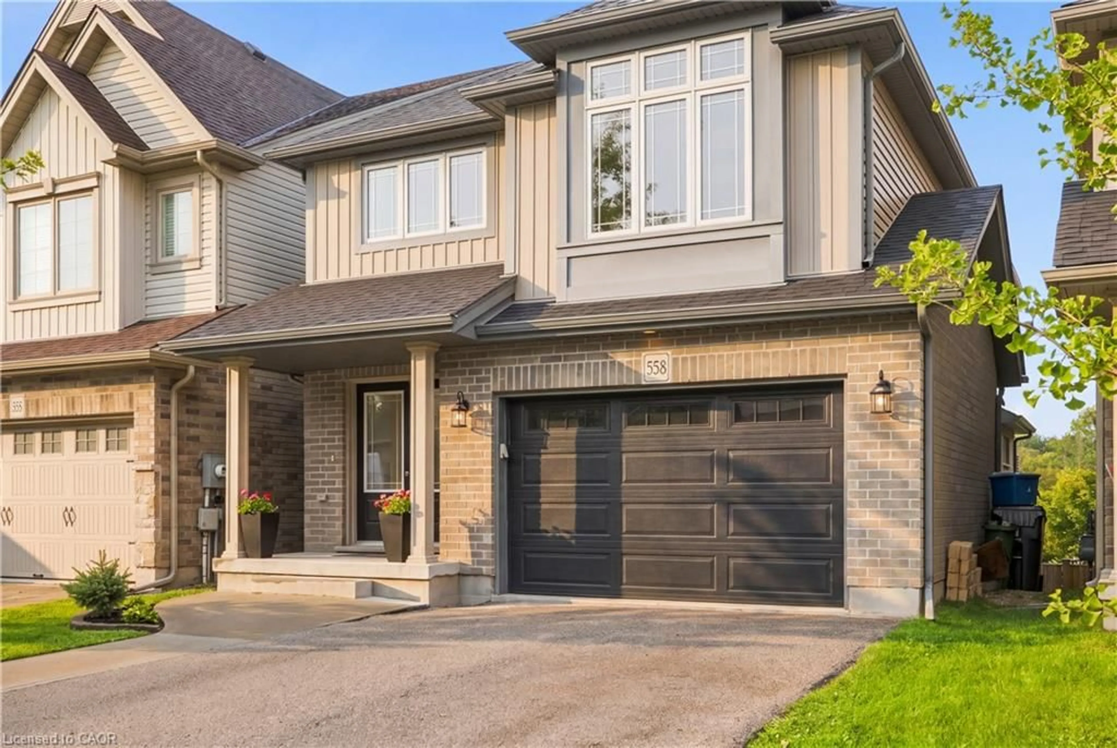 Home with brick exterior material, street for 558 Starwood Dr, Guelph Ontario N1E 7A4