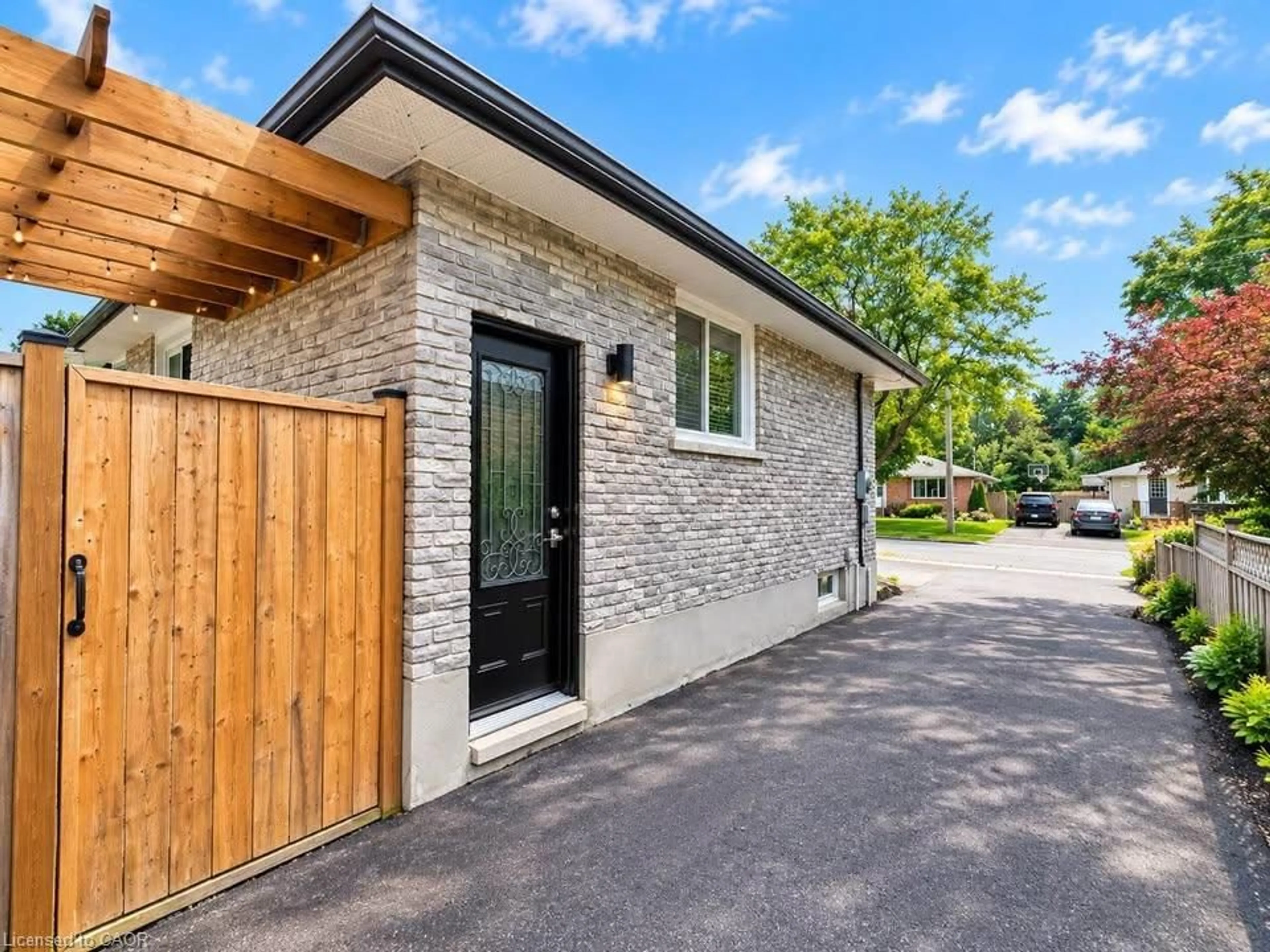 Home with brick exterior material, street for 137 Country Club Dr, Guelph Ontario N1E 3K8
