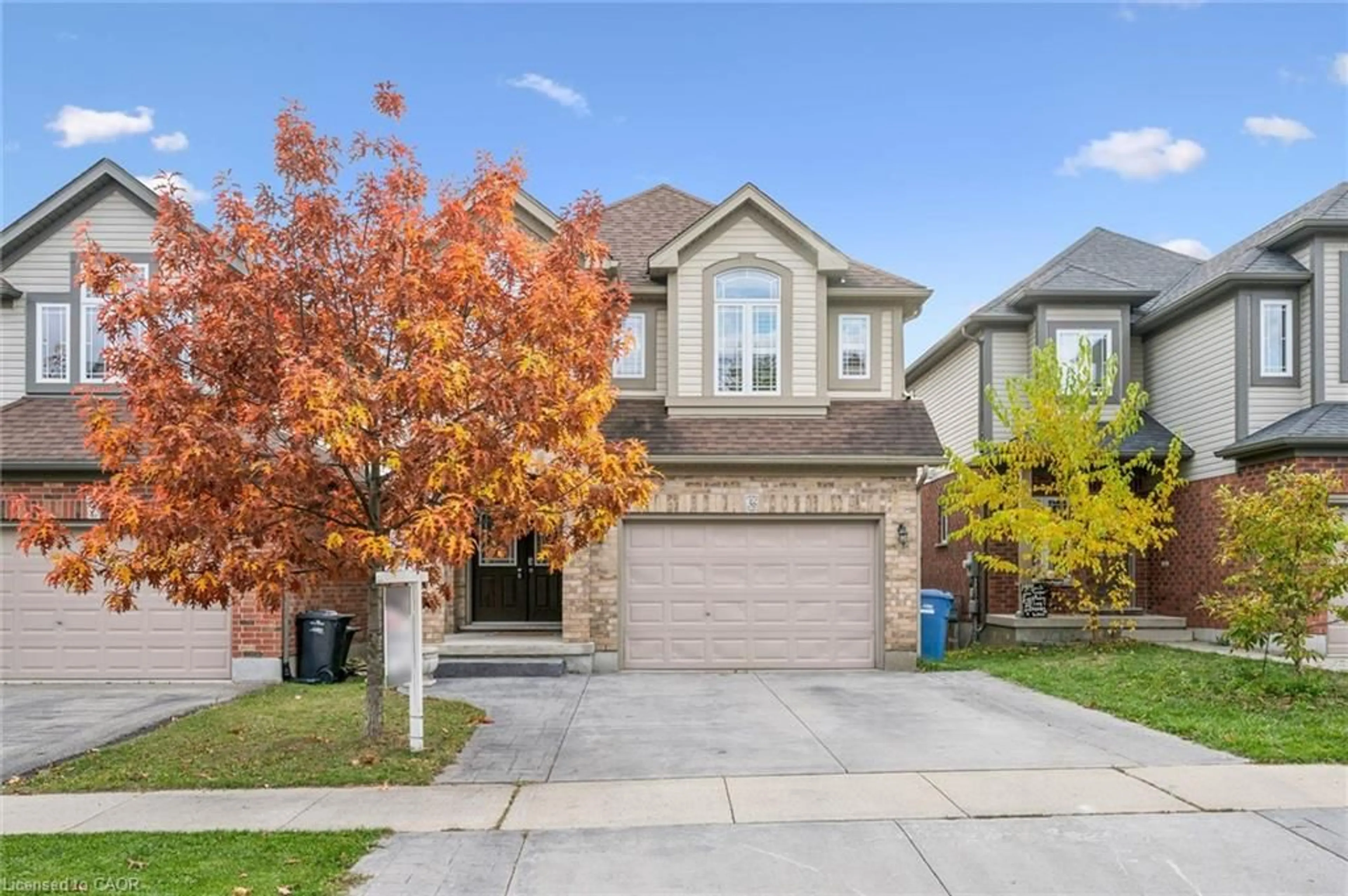 Home with brick exterior material, street for 36 Oakes Cres, Guelph Ontario N1E 0J6