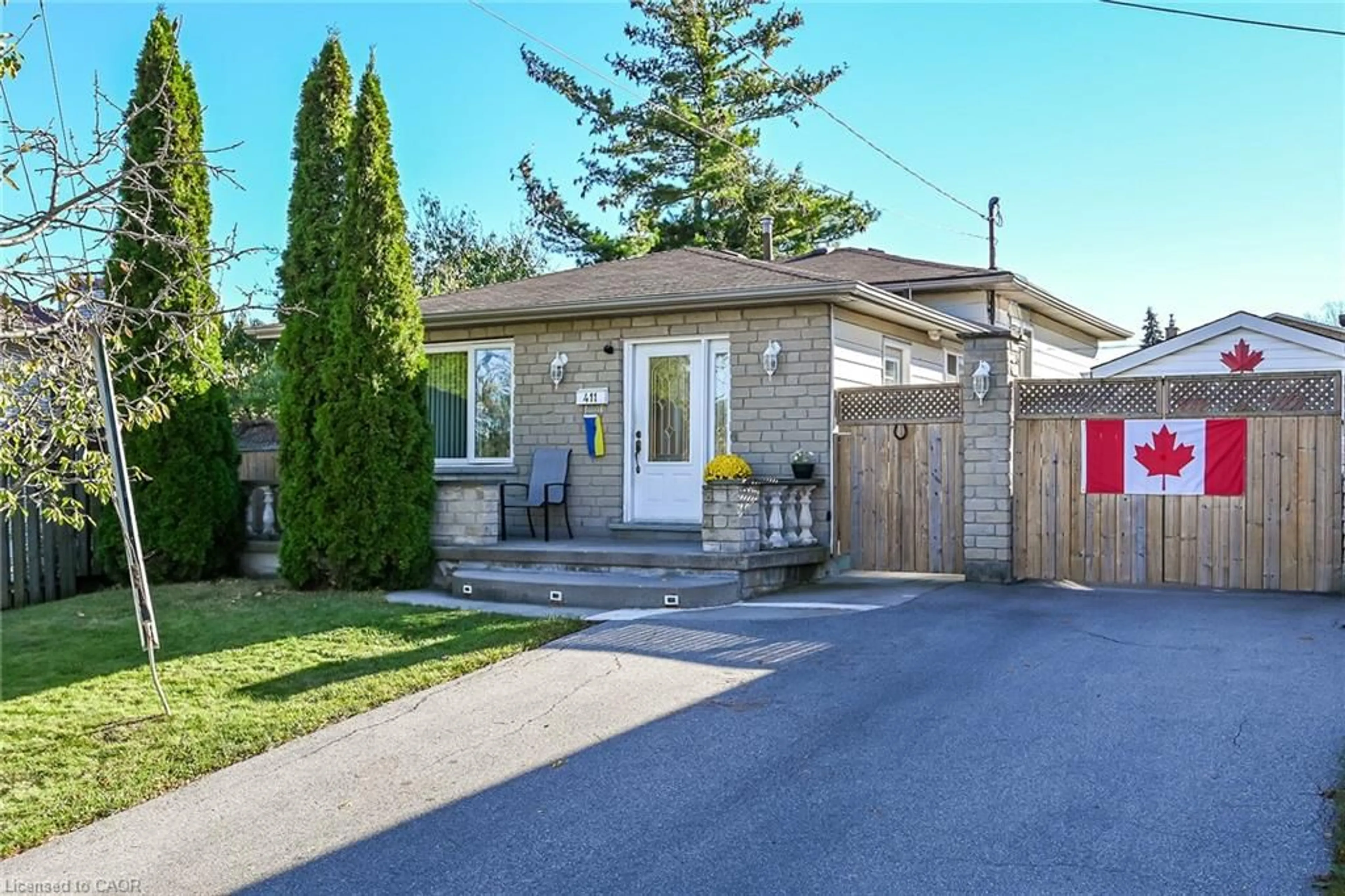 Home with brick exterior material, street for 411 Queen Victoria Dr, Hamilton Ontario L8W 1G7