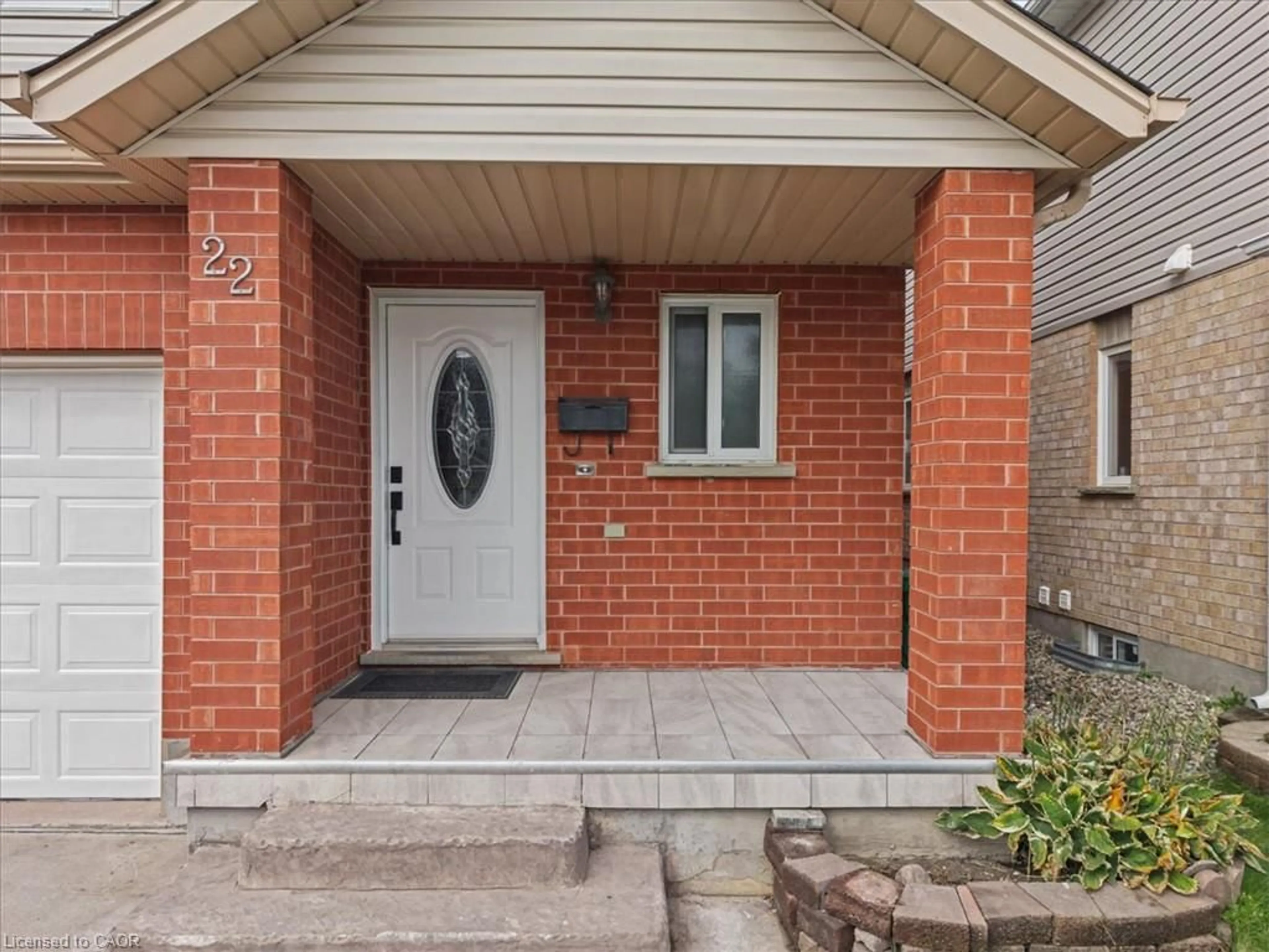Home with brick exterior material, street for 22 Indigo St, Kitchener Ontario N2E 4E8
